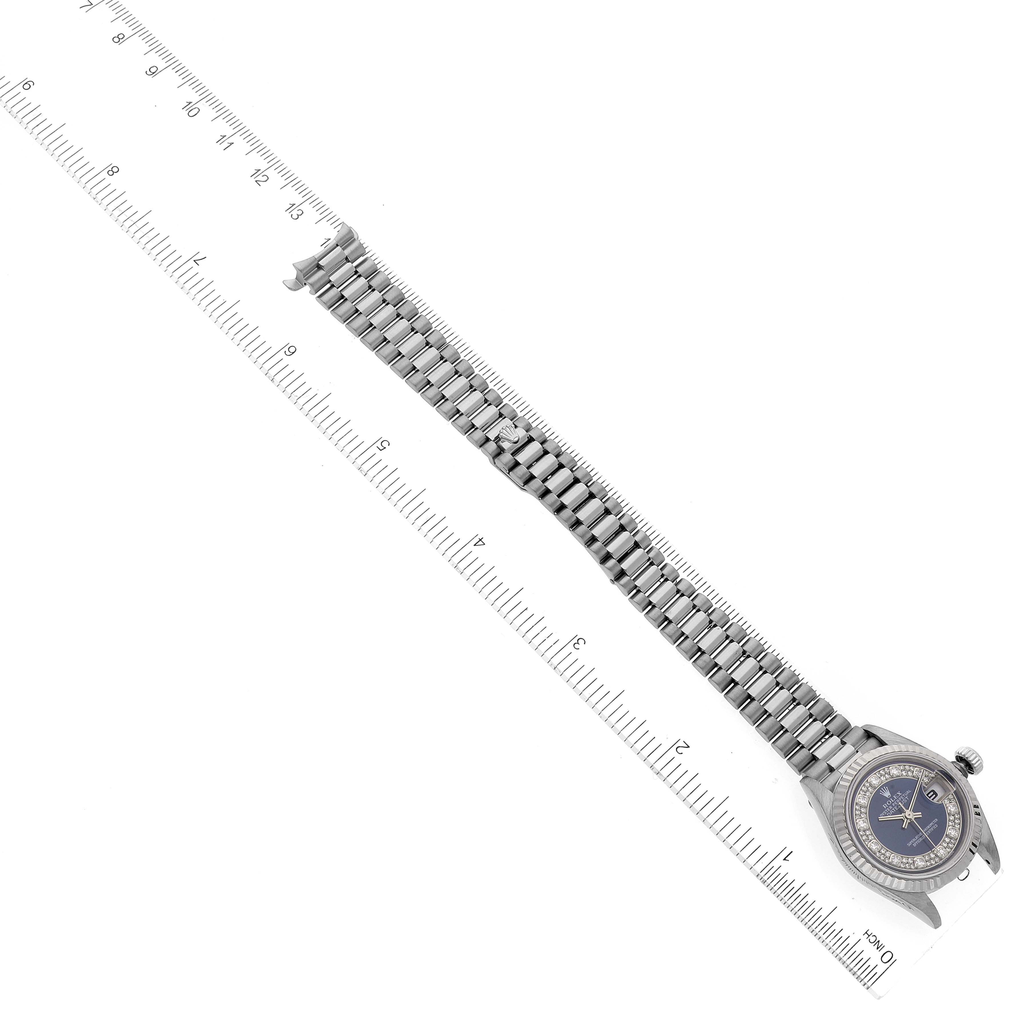 The image shows a top-down view of a Rolex President 69179 Women's White Gold Blue Dial 69179 Women's White Gold Blue Dial model watch with a visible band measured with a ruler.