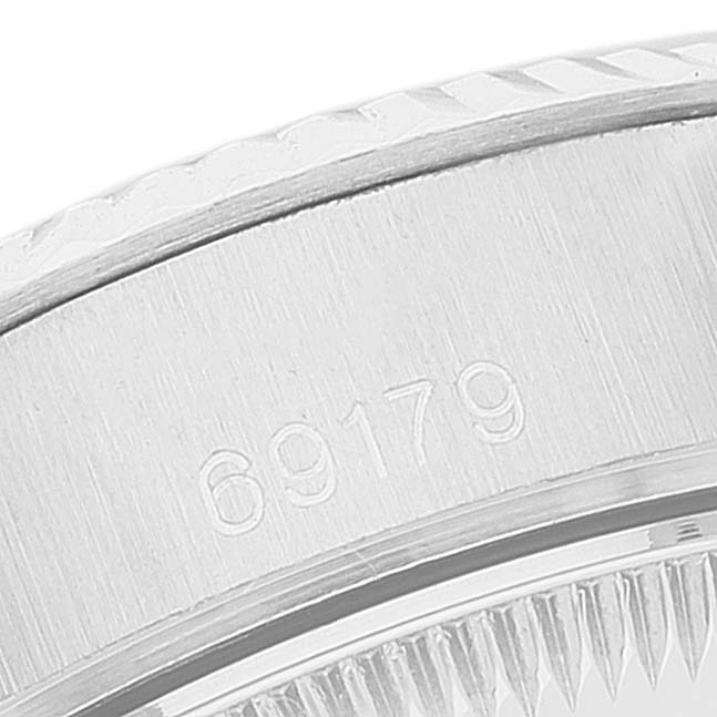 This close-up image shows the side casing of a Rolex President 69179 Women's White Gold Blue Dial 69179 Women's White Gold Blue Dial model watch, displaying the model number 69179.