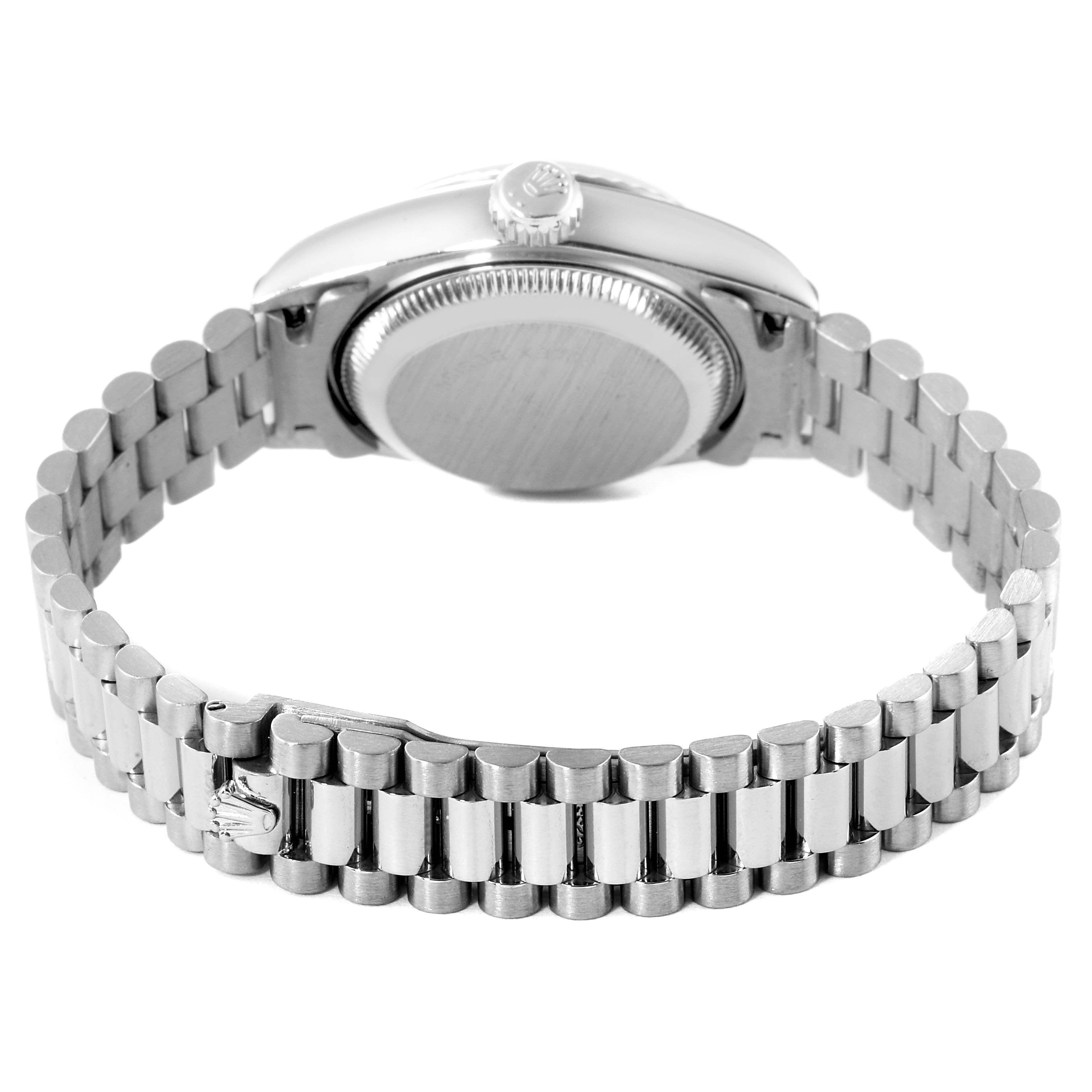 The image shows the back of the Rolex President 69179 Women's White Gold Blue Dial 69179 Women's White Gold Blue Dial model watch, focusing on its case back and bracelet.