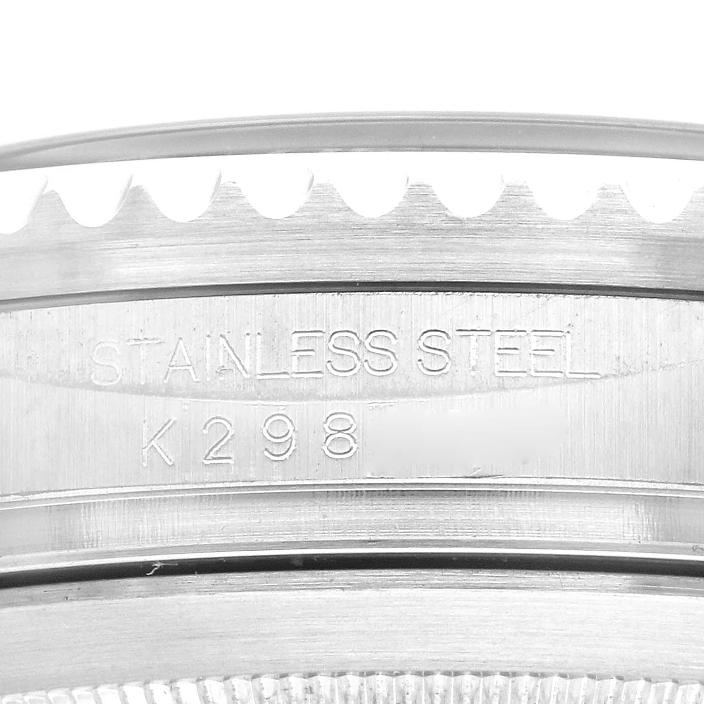 This close-up image shows the side of the bezel and engraved stainless steel caseback of a Rolex Sea-Dweller 16600 Men
s Stainless Steel Black Dial 16600 Men
s Stainless Steel Black Dial watch.