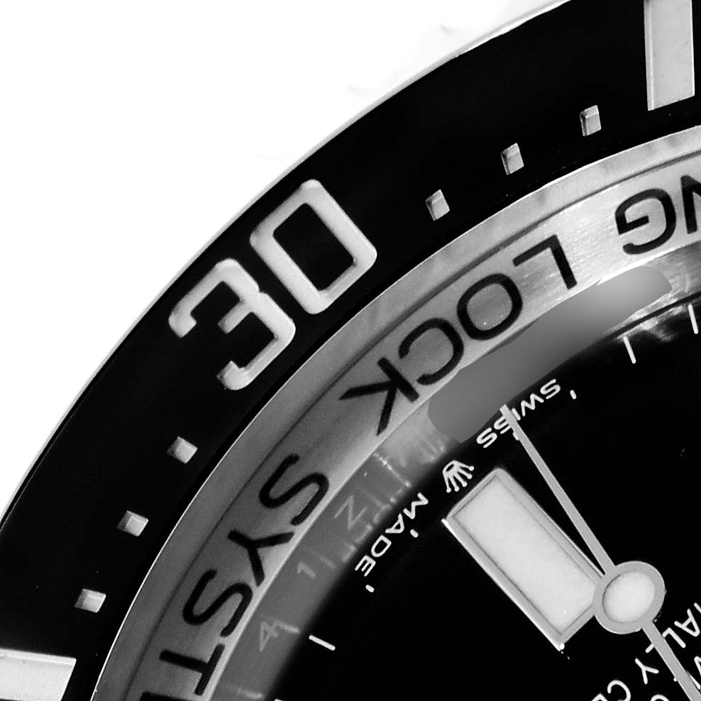 This image shows a close-up angle of the bezel, part of the dial, and the minute hand of the Rolex Sea-Dweller 136660 Men
s Stainless Steel Black Dial 136660 Men
s Stainless Steel Black Dial watch.