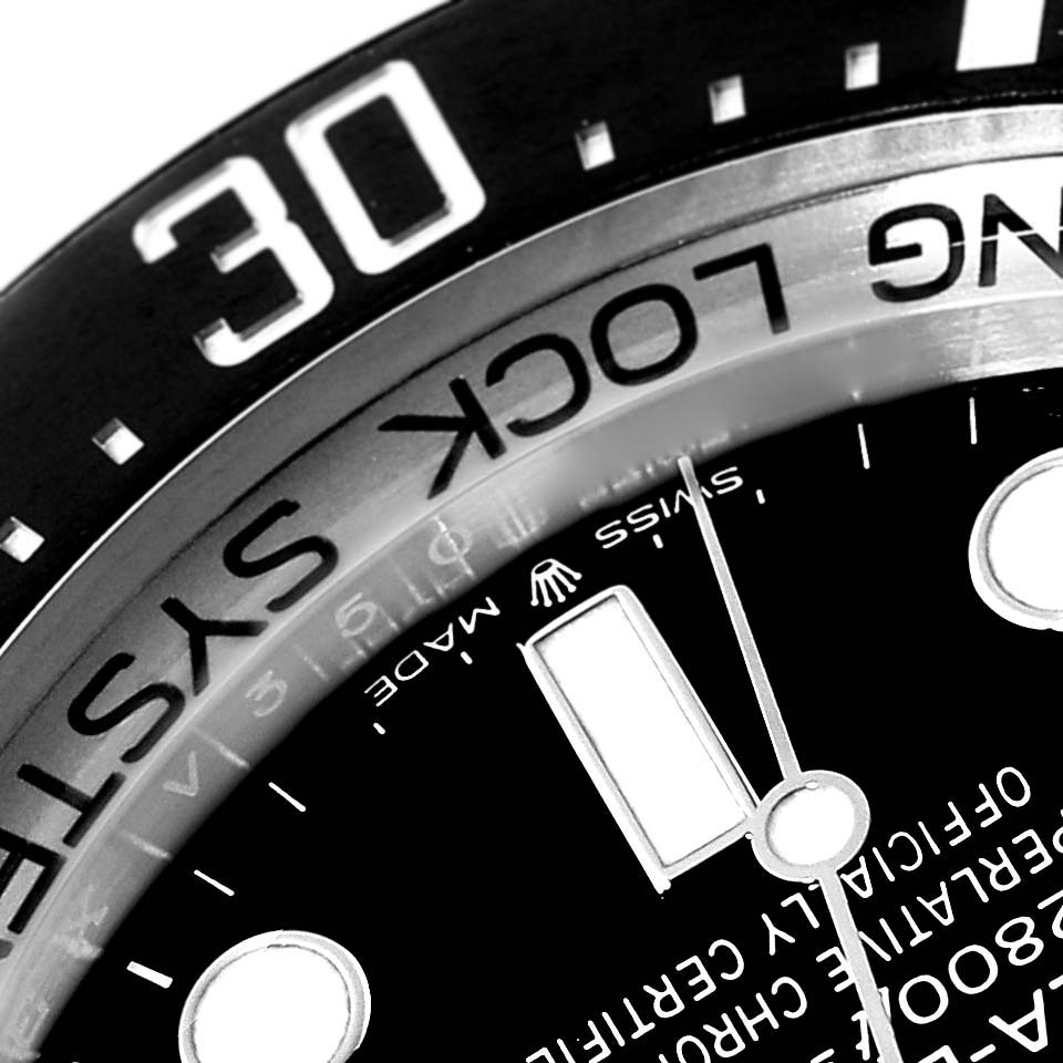 The image shows a close-up of the bezel and dial of a Rolex Sea-Dweller 126660 Men
s Stainless Steel Blue Dial 126660 Men
s Stainless Steel Blue Dial watch from an angled view.