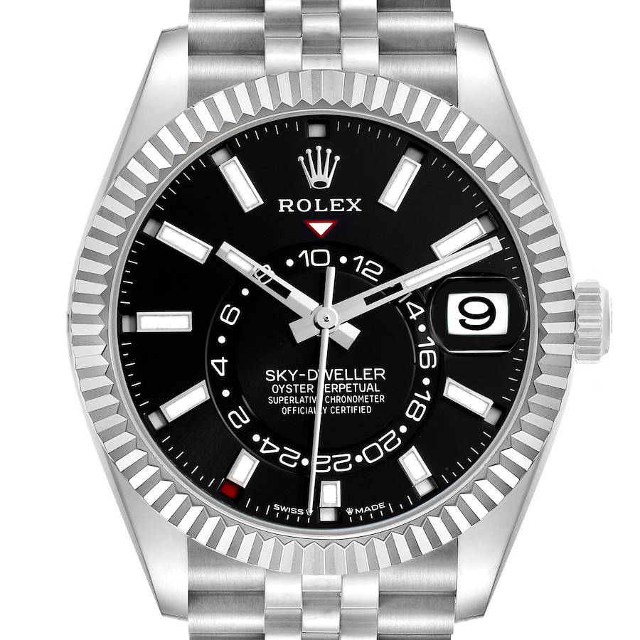 The Rolex Sky-Dweller watch is shown from the front, displaying the black dial, hands, bezel, indices, and date window.