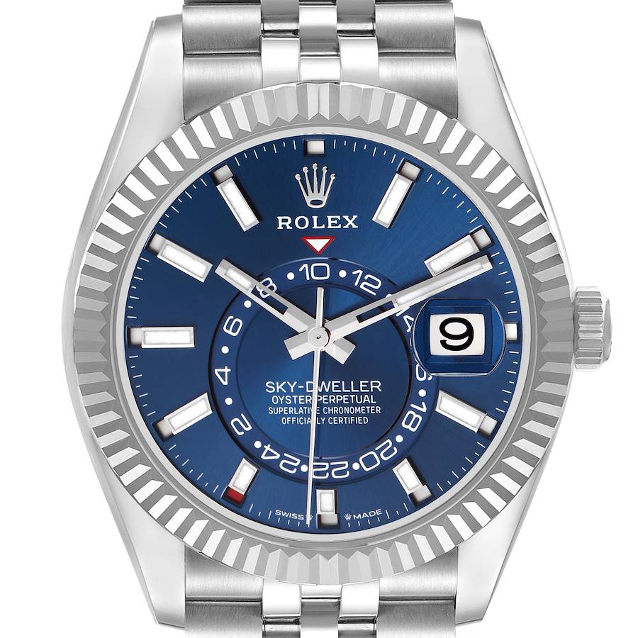 The Rolex Sky-Dweller watch is shown from a front angle, highlighting its blue dial, bezel, and part of the bracelet.