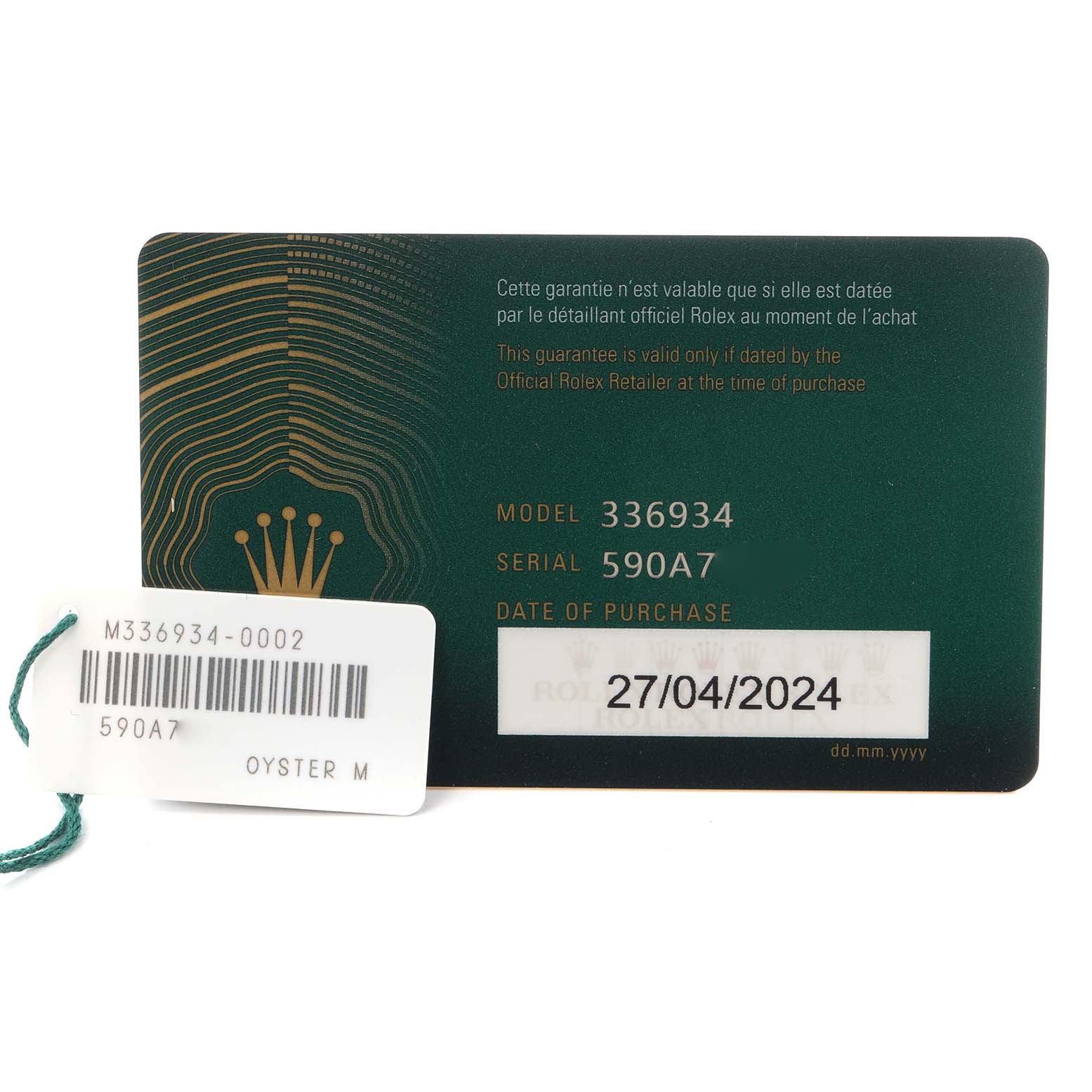 The image shows the warranty card and tag for the Rolex Sky-Dweller 336934 Men
s Stainless Steel Green Dial 336934 Men
s Stainless Steel Green Dial watch model 336934.
