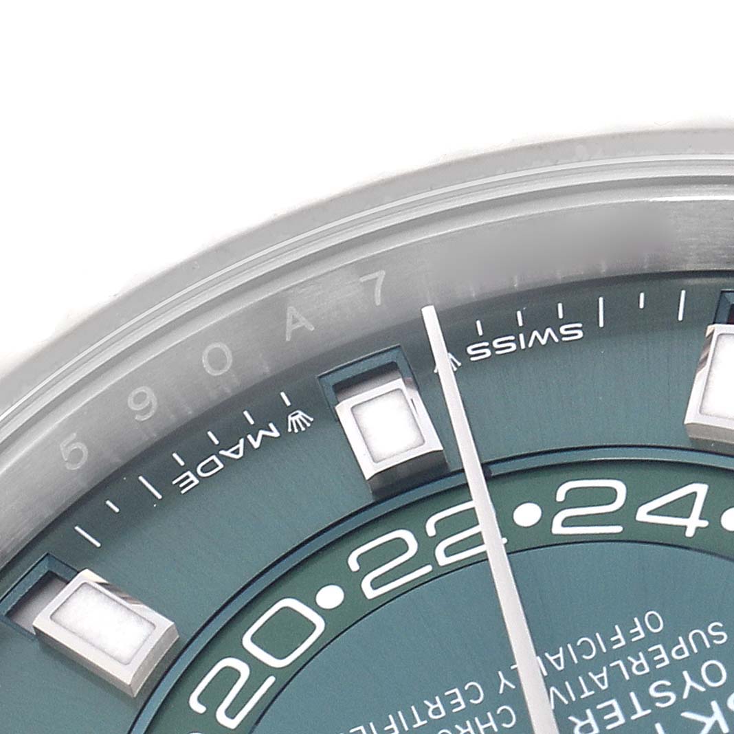 The image shows a close-up of the dial of a Rolex Sky-Dweller 336934 Men
s Stainless Steel Green Dial 336934 Men
s Stainless Steel Green Dial, highlighting the hour markers and part of the bezel.