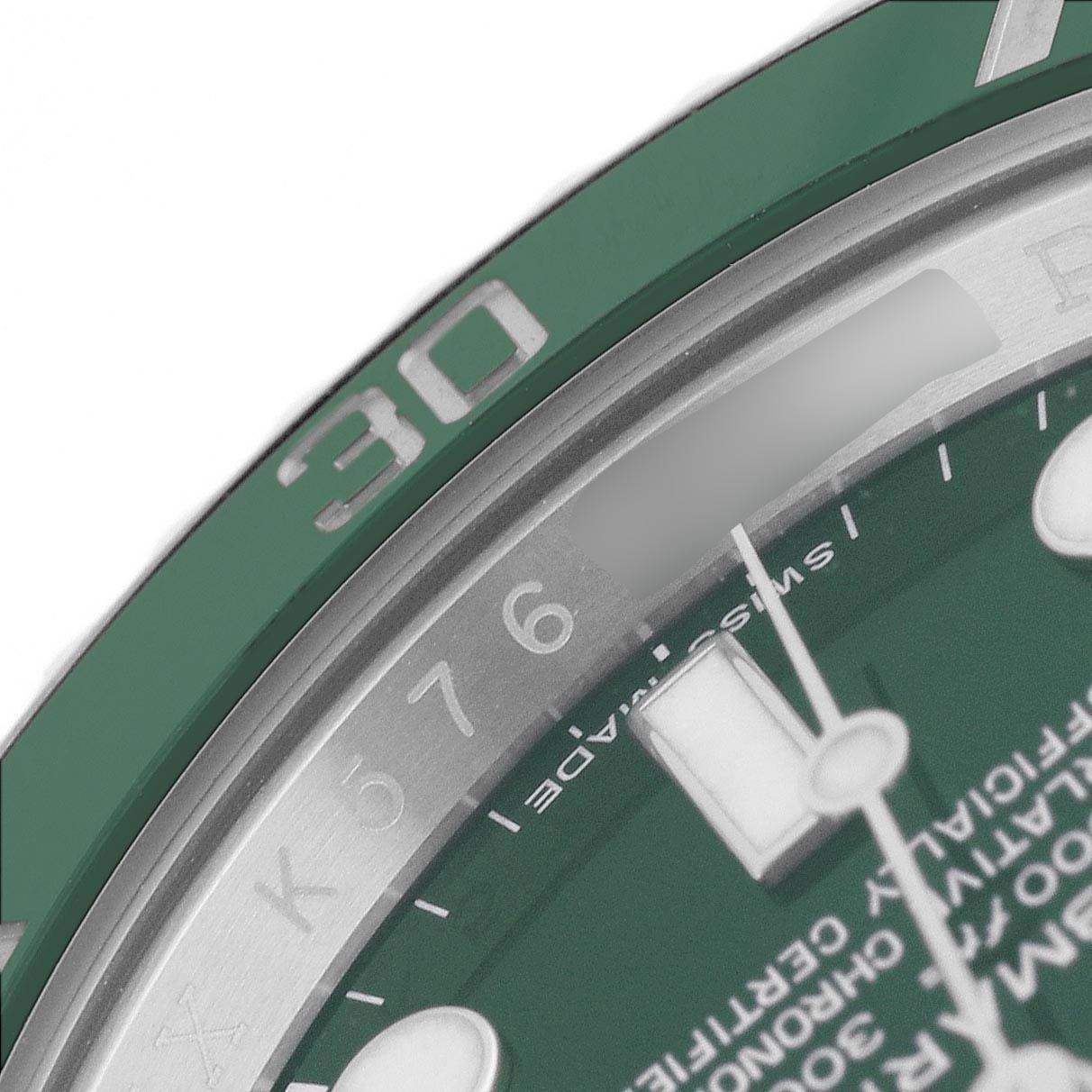 The image shows a close-up of the dial and bezel of a Rolex Submariner 116610LV Men's Stainless Steel Green Dial, highlighting the 30-minute mark and part of the dial text.