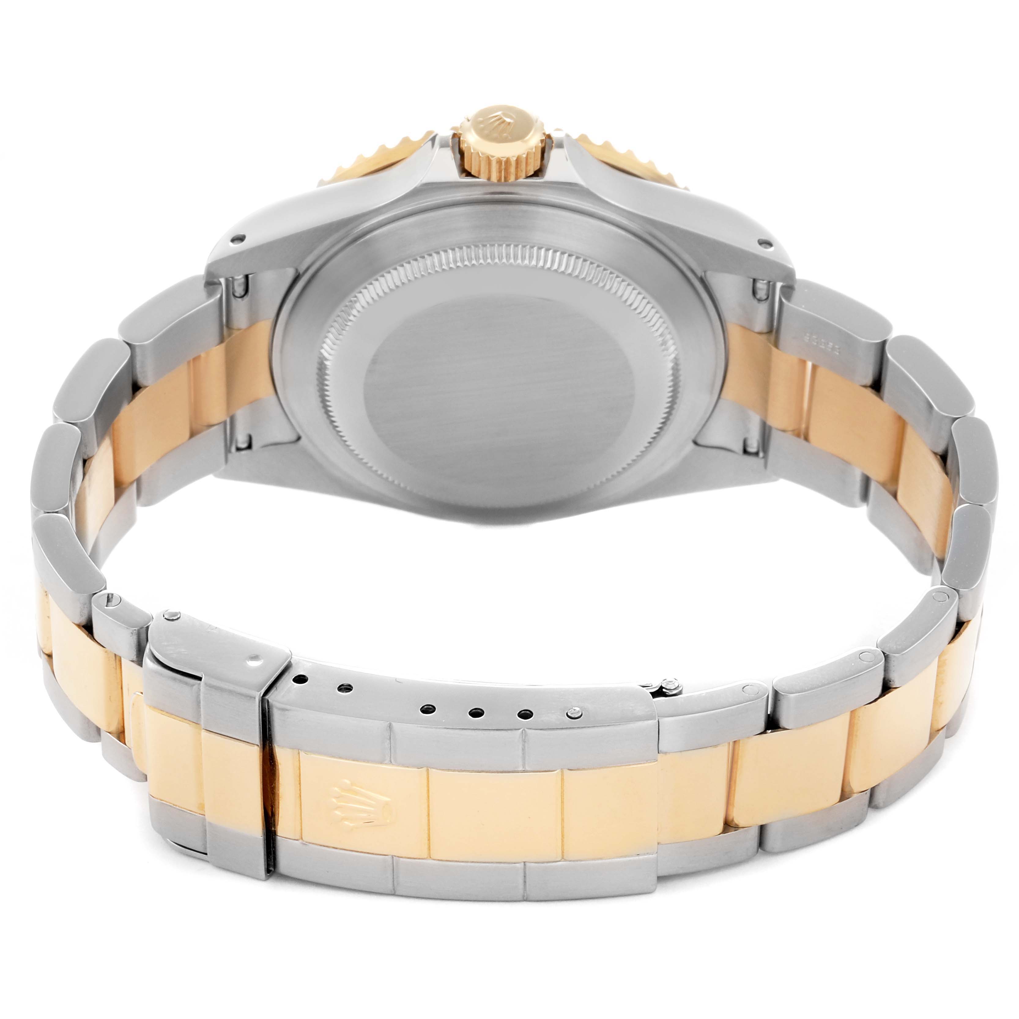 The image shows the back of a Rolex Submariner 16613 Men
s Steel and Gold (two tone) Champagne Dial 16613 Men
s Steel and Gold (two tone) Champagne Dial watch, highlighting the case back, crown, and two-tone bracelet clasp.