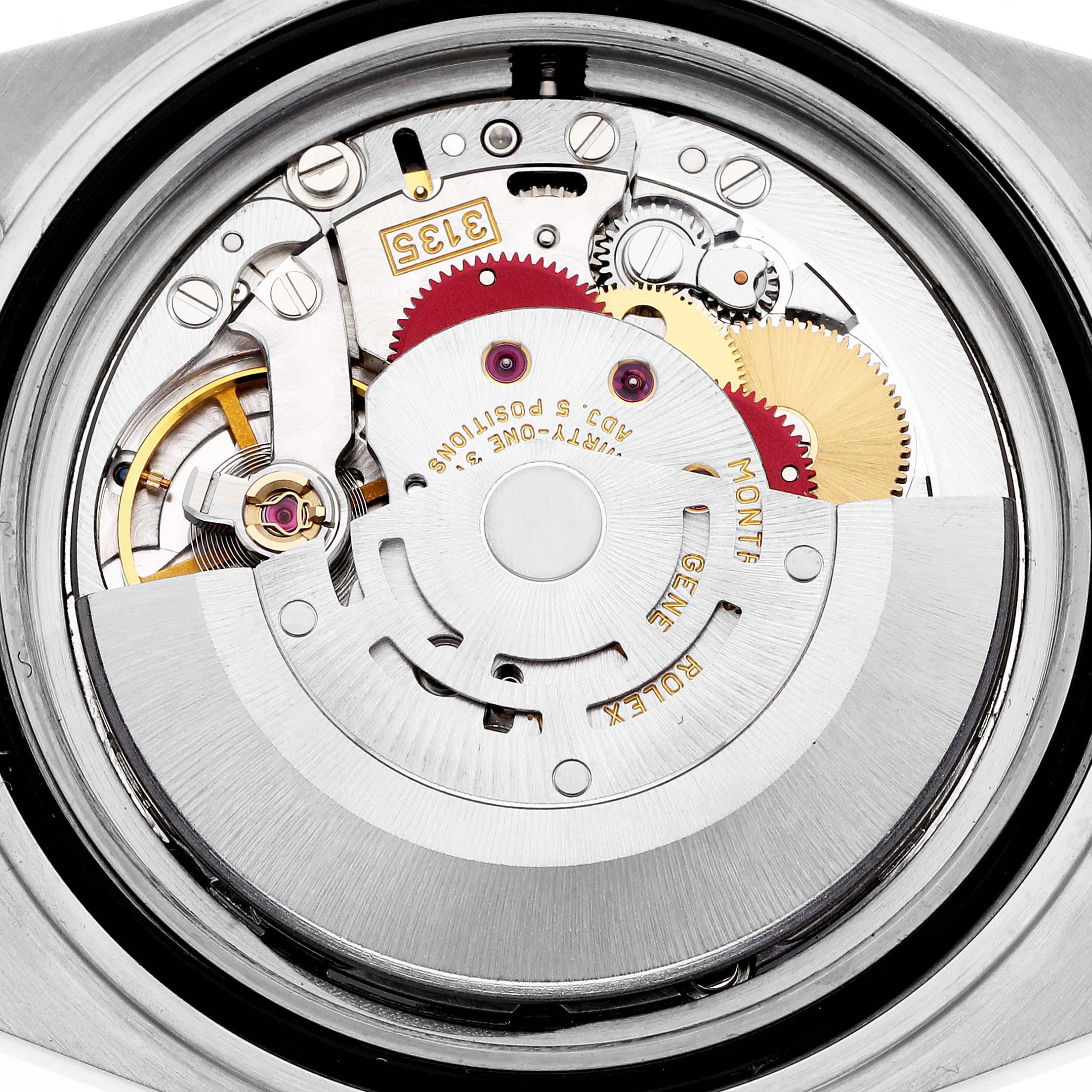 The image shows the movement of a Rolex Submariner 16613 Men
s Steel and Gold (two tone) Champagne Dial 16613 Men
s Steel and Gold (two tone) Champagne Dial, viewed from the back, highlighting the gears and rotor.
