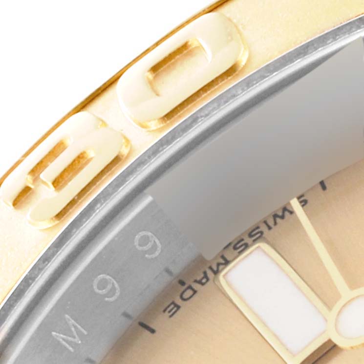 The close-up image showcases the bezel and part of the dial of a Rolex Yacht-Master 16623 Men's Steel and Gold (two tone) Champagne Dial 16623 Men's Steel and Gold (two tone) Champagne Dial watch.