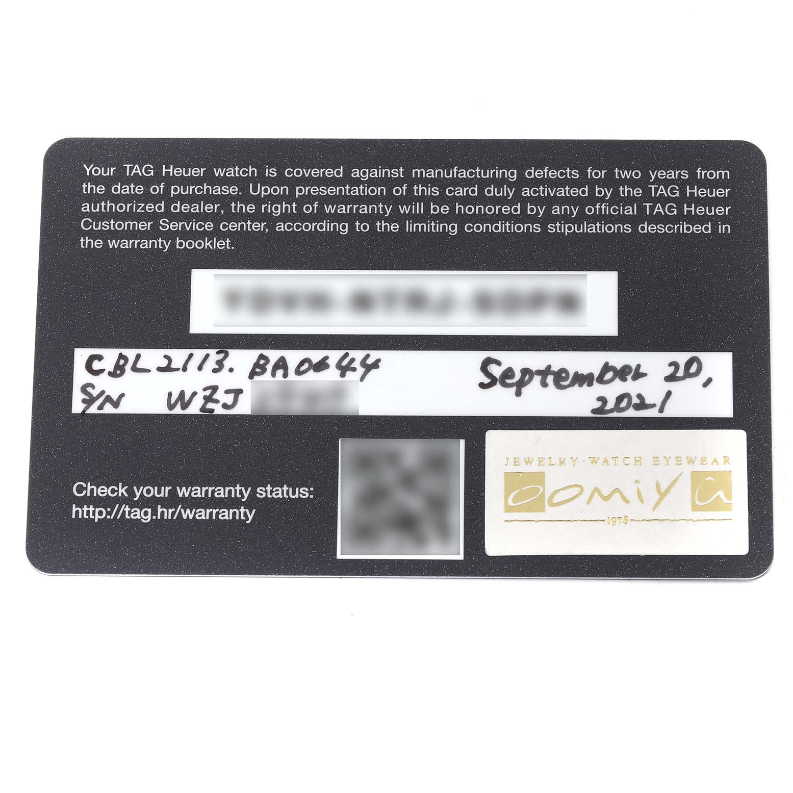 This image shows a warranty card for a Tag Heuer Monaco CBL2113.BA0644 Men
s Stainless Steel Black Dial CBL2113.BA0644 Men
s Stainless Steel Black Dial model watch.