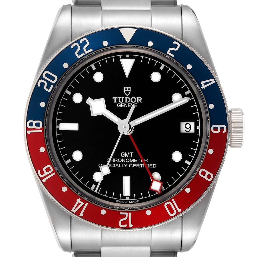 The Tudor Heritage Black Bay watch is shown from a frontal angle, displaying the bezel, dial, hands, date window, and crown.