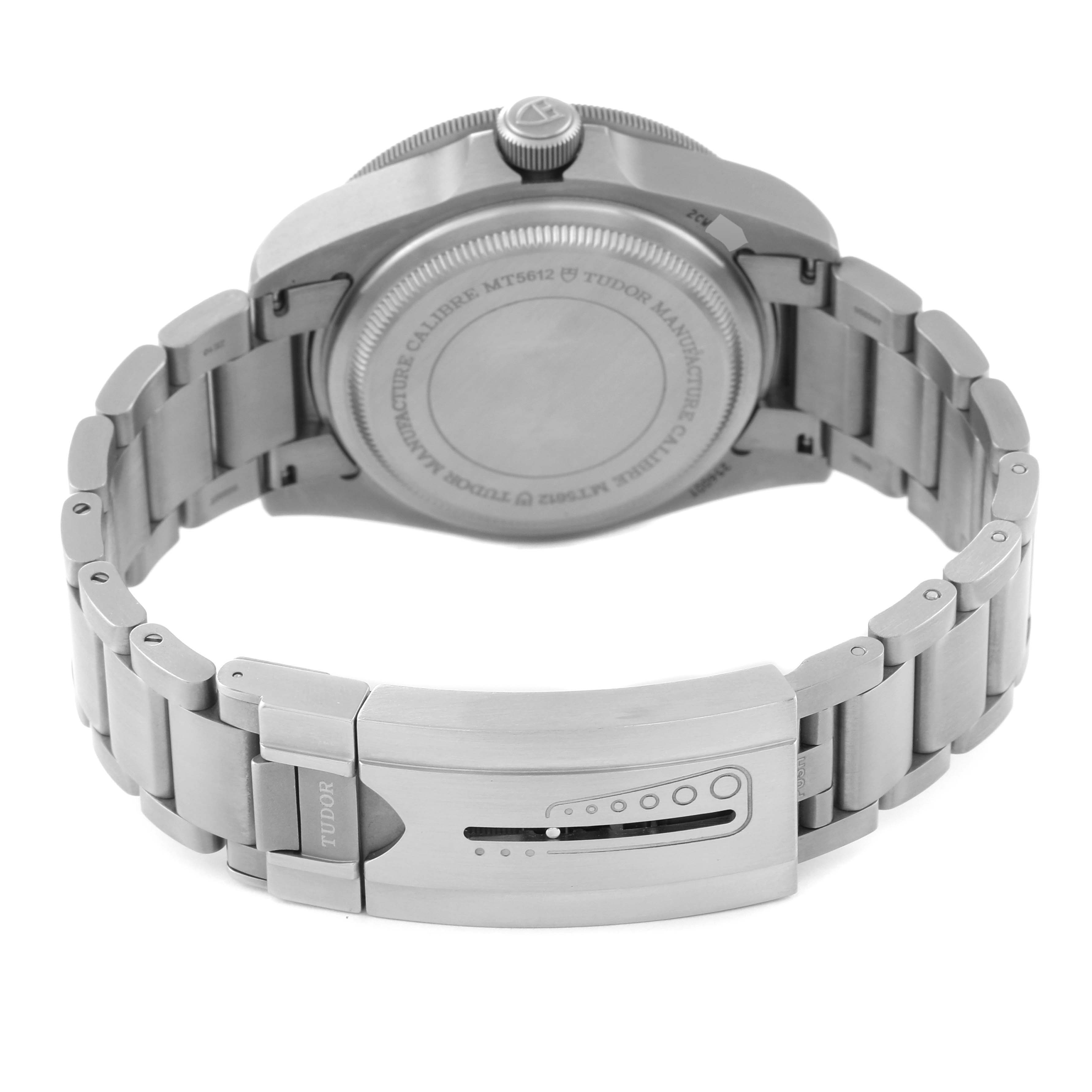 This image shows the underside angle of a Tudor Pelagos 2CWXXXX Men's Titanium Blue Dial 2CWXXXX Men's Titanium Blue Dial watch, highlighting the case back and the clasp of the metal bracelet.