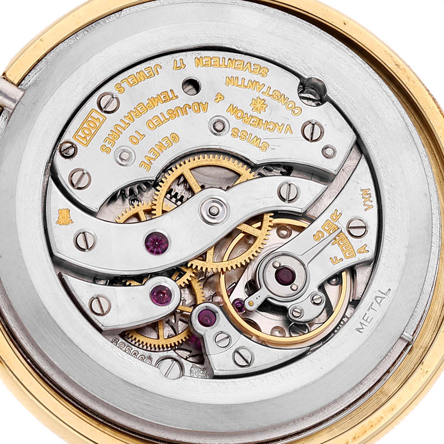 The image shows the intricate inner mechanism of a vintage Vacheron Constantin watch, highlighting the gears and jewels.