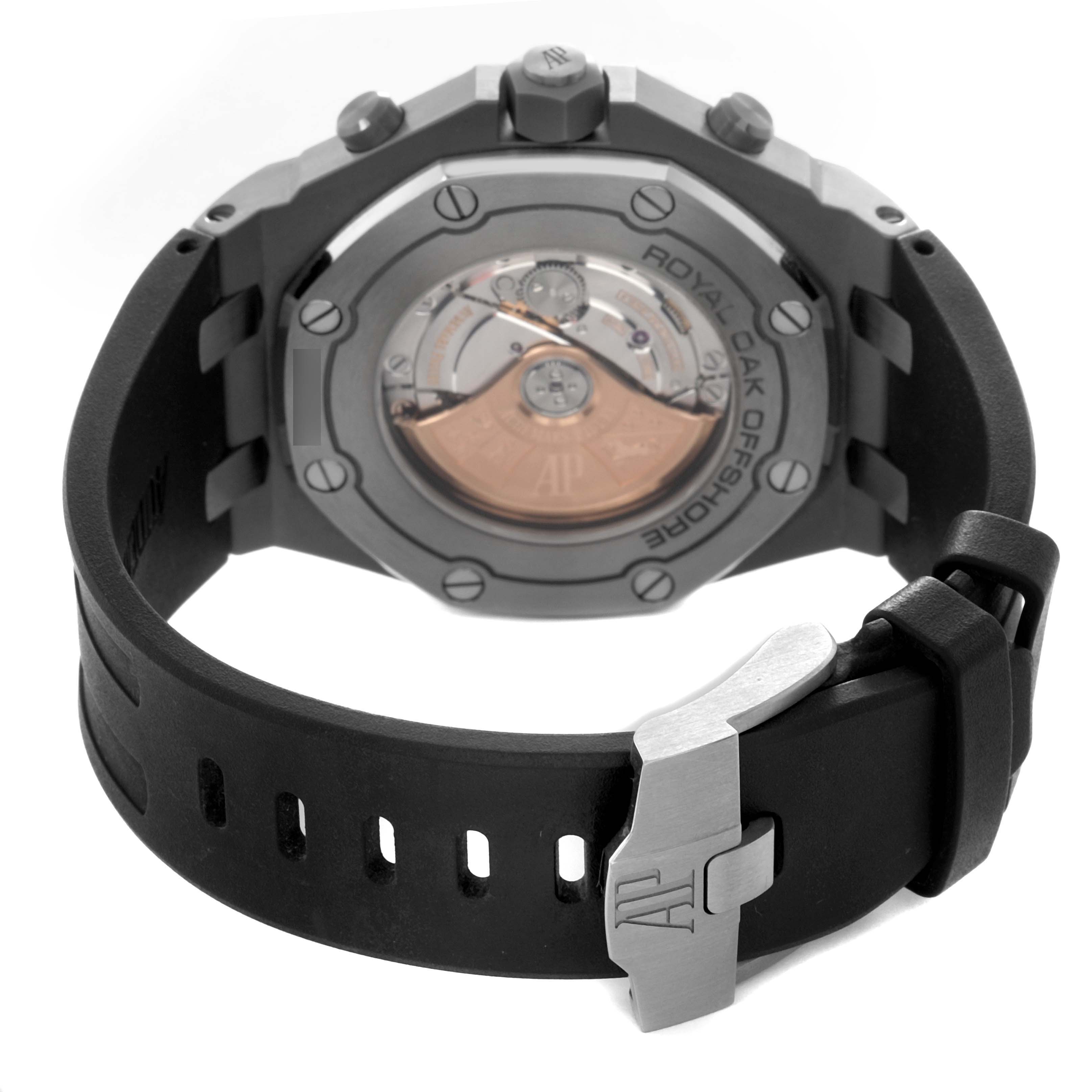 The image shows the back of the Audemars Piguet Royal Oak Offshore 26470IO.OO.A006CA.01 Men
s Titanium Grey Dial 26470IO.OO.A006CA.01 Men
s Titanium Grey Dial, highlighting the rotor and strap clasp.