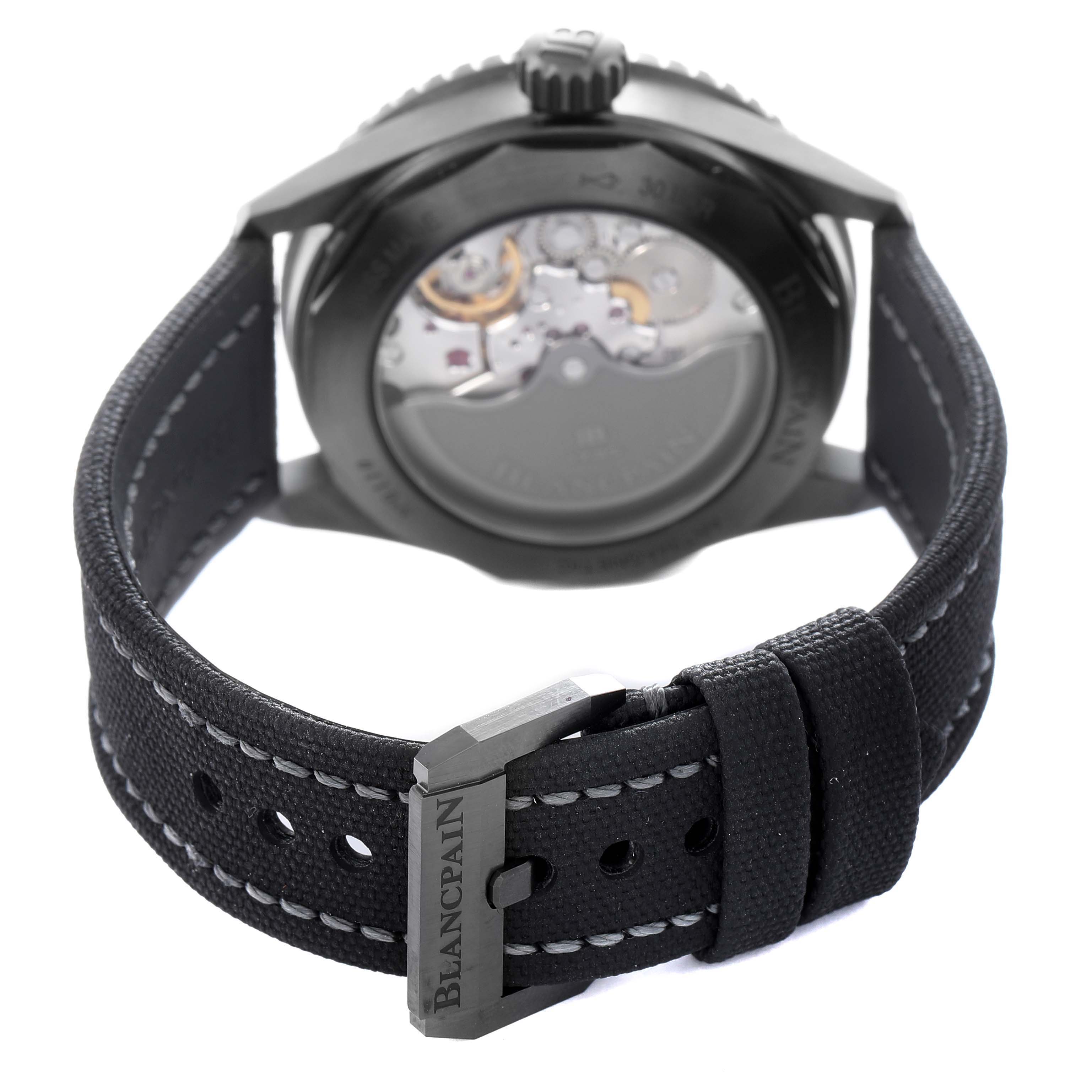 The Blancpain Fifty Fathoms 5000-0153-B52A Men
s Ceramic Green Dial 5000-0153-B52A Men
s Ceramic Green Dial watch is shown from the back, highlighting the case back and strap with buckle detail.