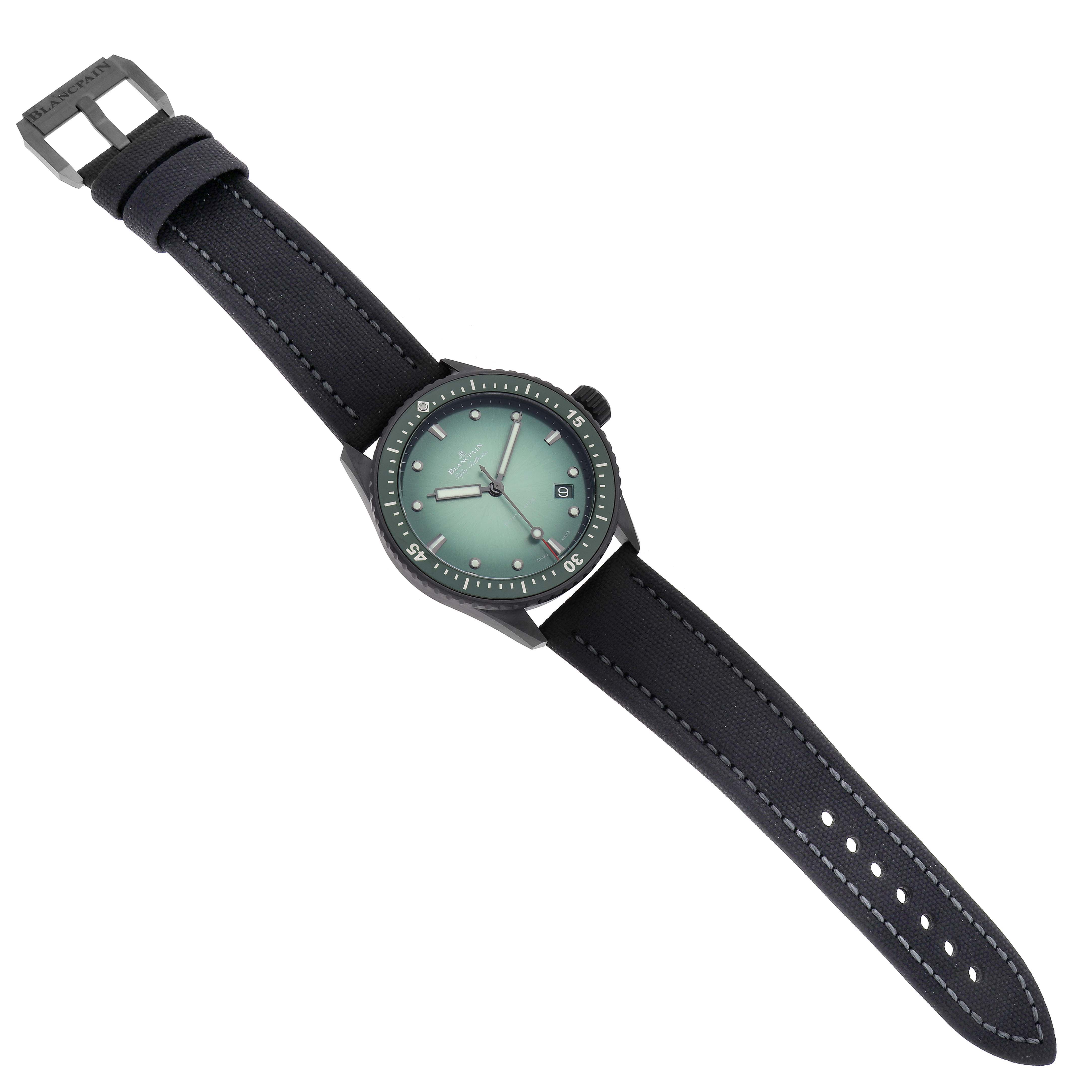The Blancpain Fifty Fathoms 5000-0153-B52A Men
s Ceramic Green Dial 5000-0153-B52A Men
s Ceramic Green Dial watch is shown from a top view, displaying the face, bezel, crown, and full strap.