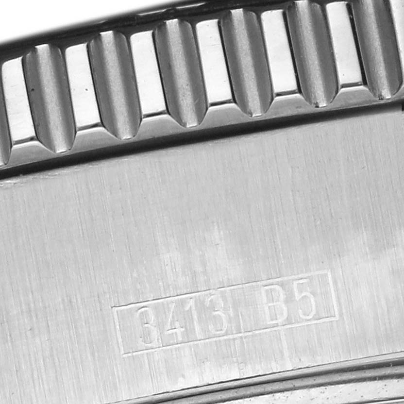 The image shows a detailed view of the bezel and case edge of a Breitling Superocean A17391 Men
s Stainless Steel Black Dial A17391 Men
s Stainless Steel Black Dial watch, highlighting its serrated bezel texture.