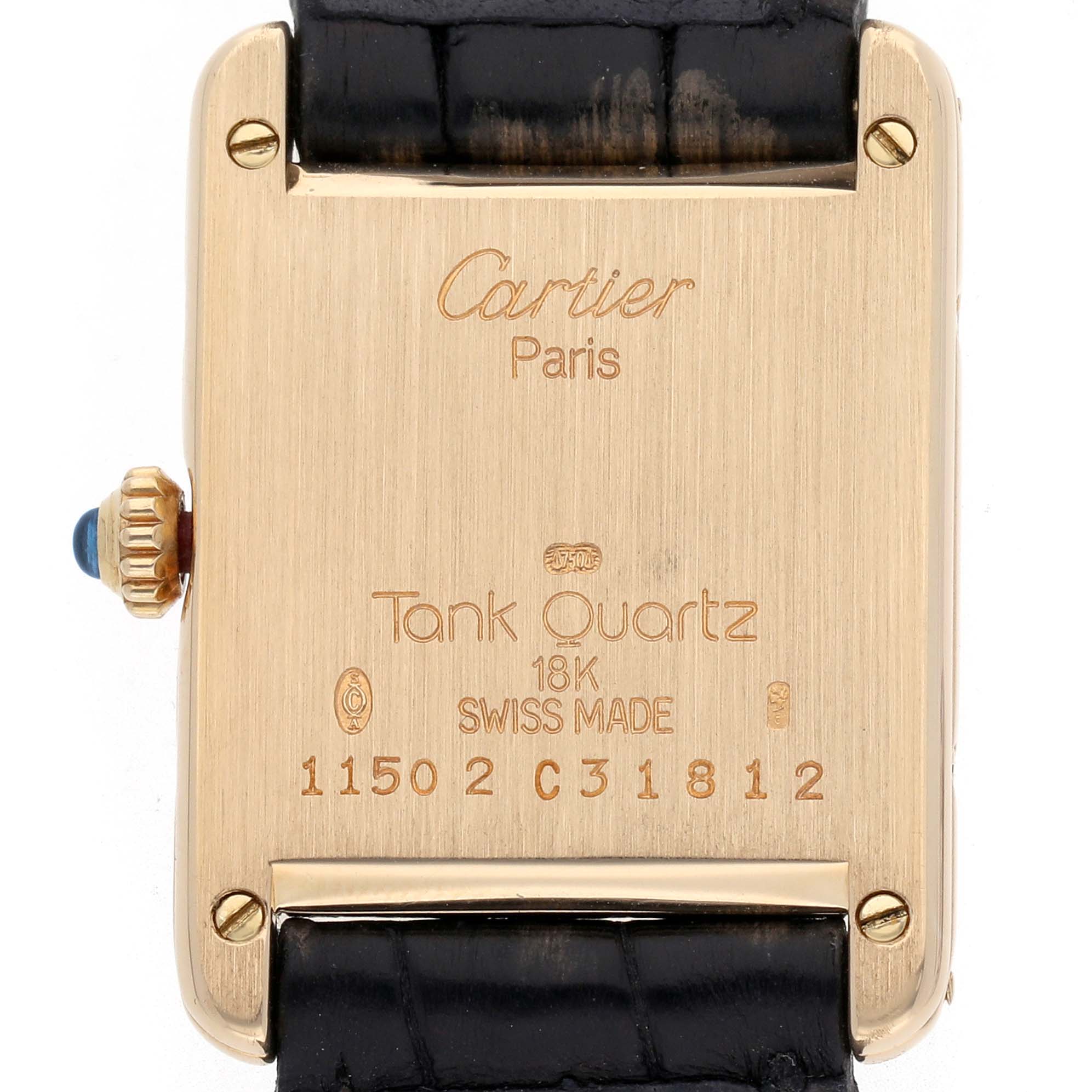 The image shows the back of a Cartier Tank Classic 1150 Women
s Yellow Gold Silver Dial 1150 Women
s Yellow Gold Silver Dial watch, displaying its inscriptions and a black leather strap attachment.