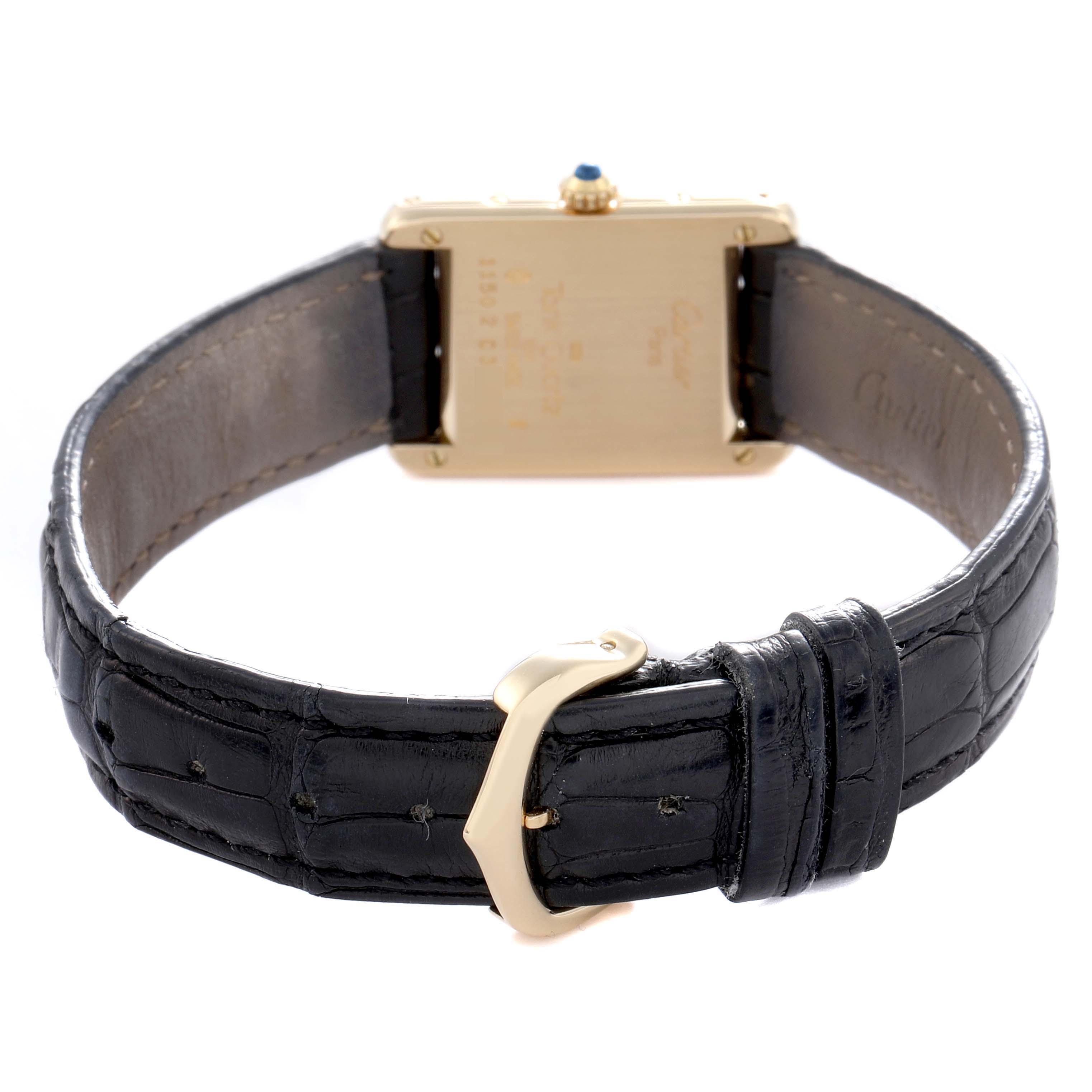 The Cartier Tank Classic 1150 Women
s Yellow Gold Silver Dial 1150 Women
s Yellow Gold Silver Dial watch is shown from the back, focusing on the strap, buckle, and case back details.