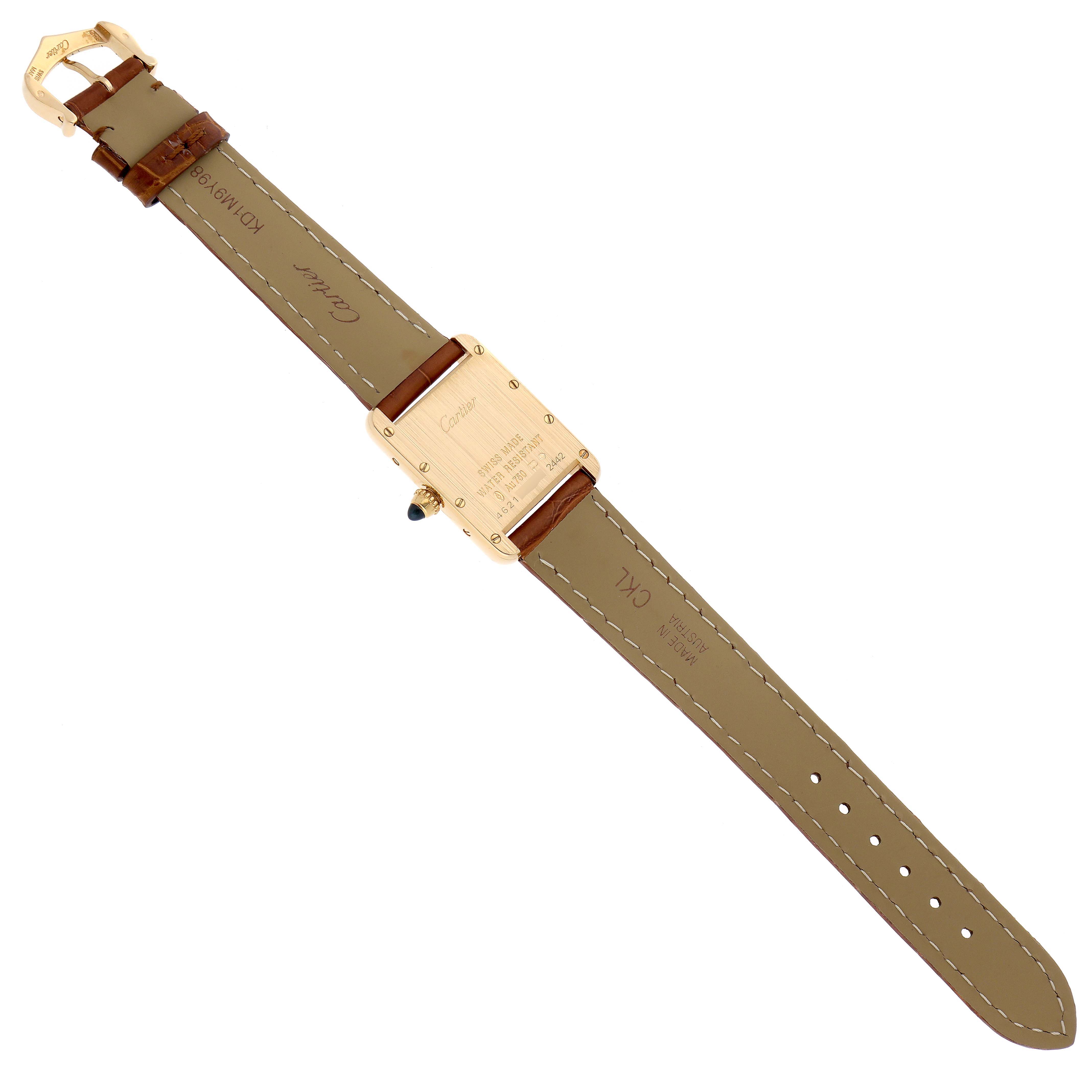 The image shows the back of the Tank Louis Cartier watch, highlighting its strap, clasp, and caseback.