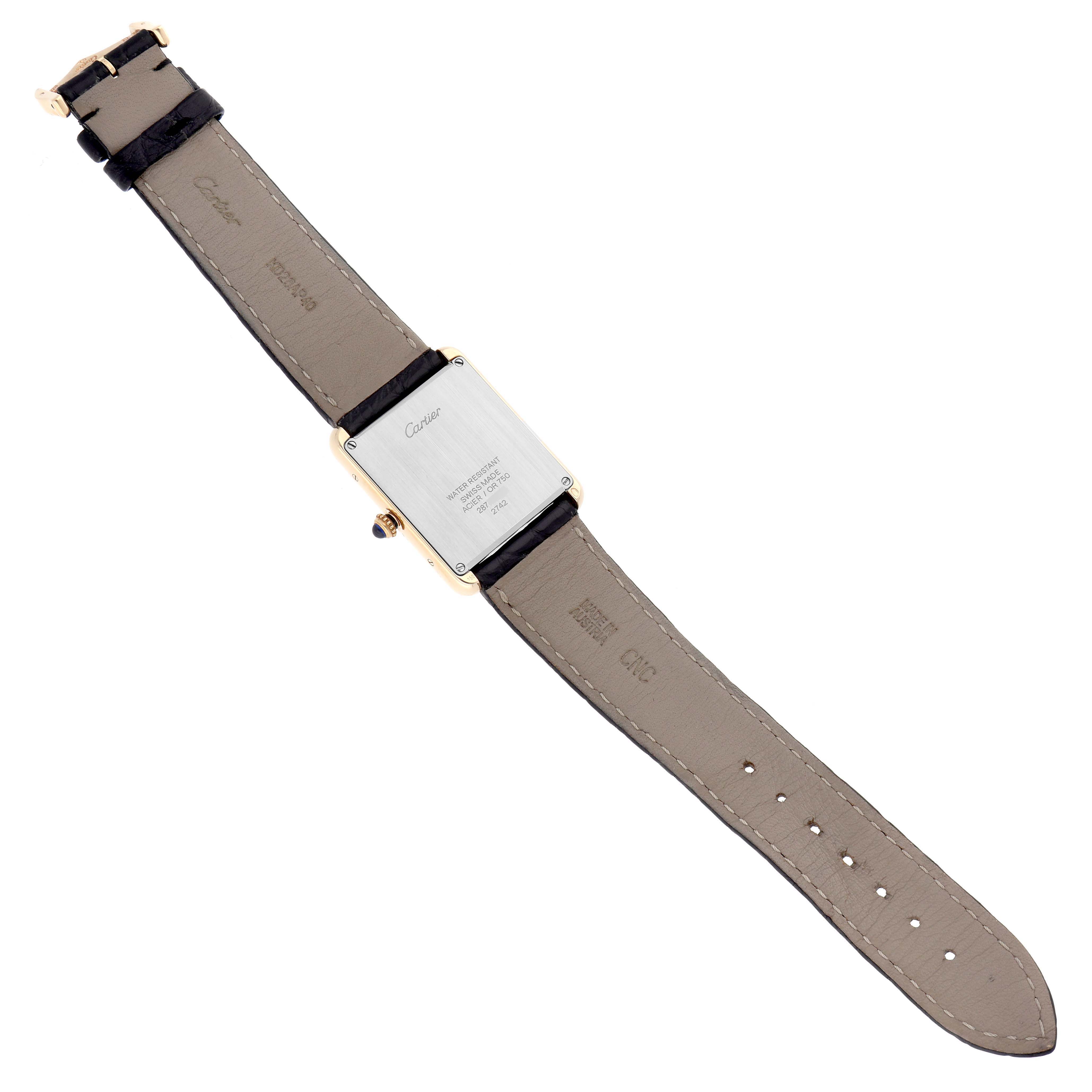 The image shows the back view of a Cartier Tank Solo W1018855 Men
s Yellow Gold Silver Dial W1018855 Men
s Yellow Gold Silver Dial watch, highlighting the leather strap and case back.