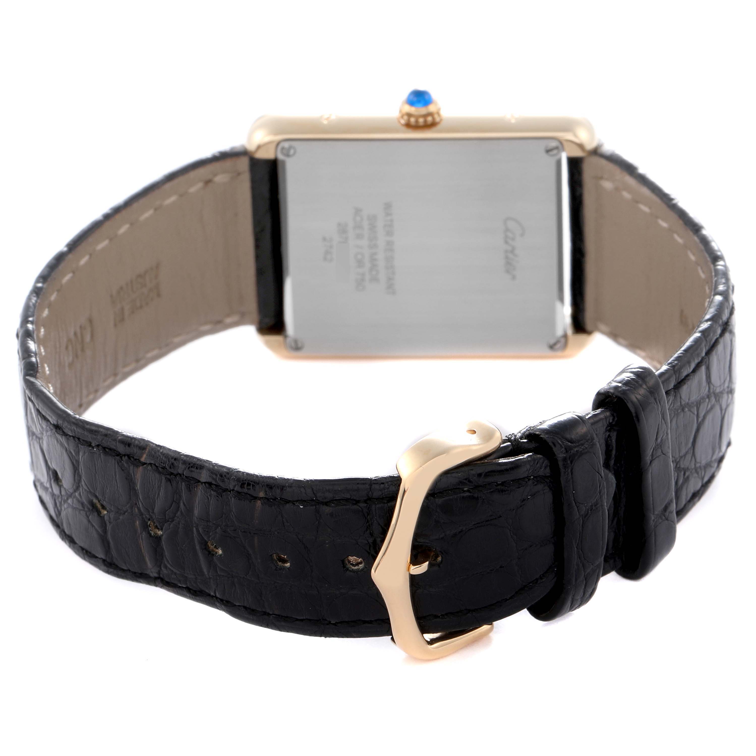 The image shows the back of the Cartier Tank Solo W1018855 Men
s Yellow Gold Silver Dial W1018855 Men
s Yellow Gold Silver Dial watch, focusing on the case, buckle, and strap.