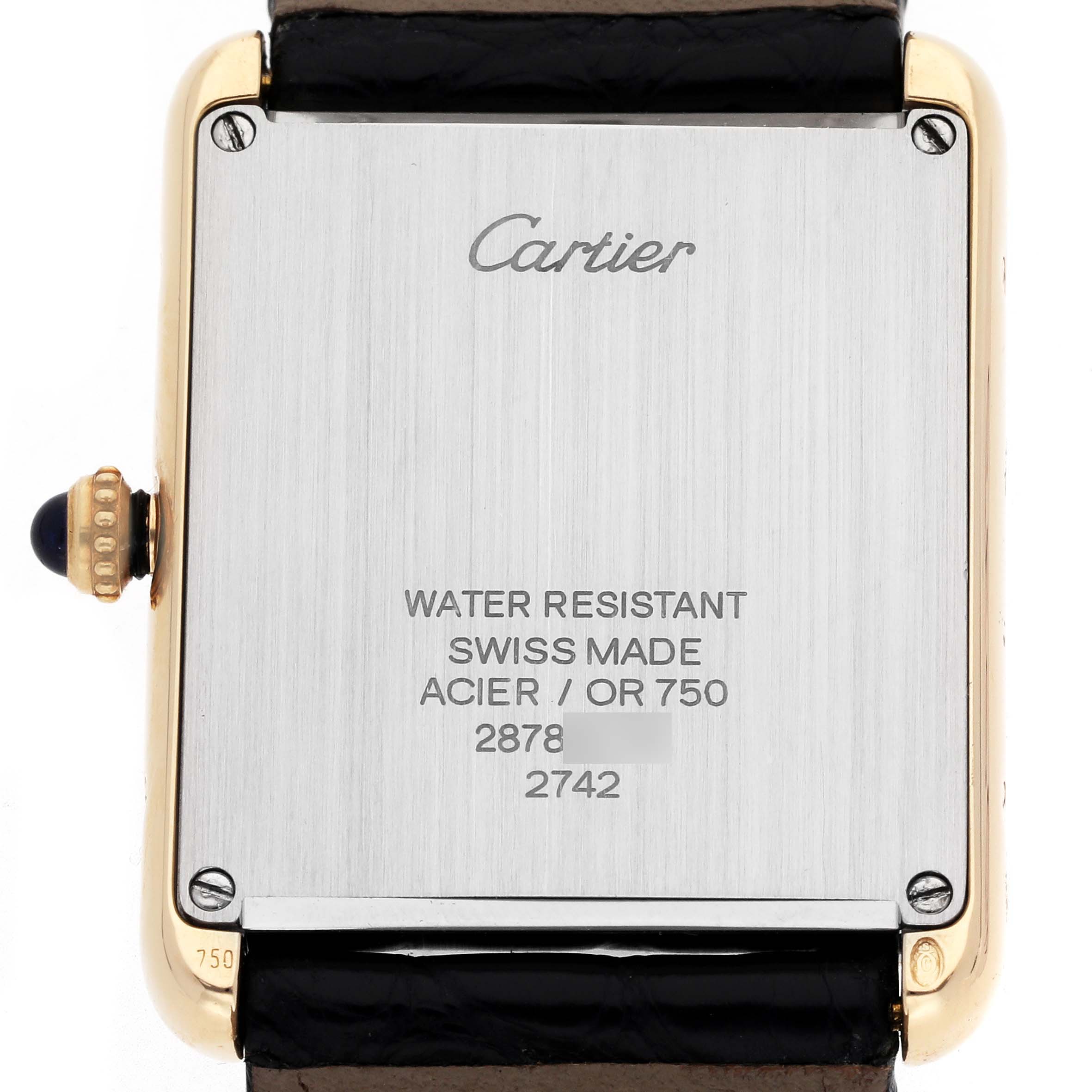 The image shows the back of a Cartier Tank Solo W1018855 Men
s Yellow Gold Silver Dial W1018855 Men
s Yellow Gold Silver Dial watch, highlighting its rectangular case, crown, and inscriptions.