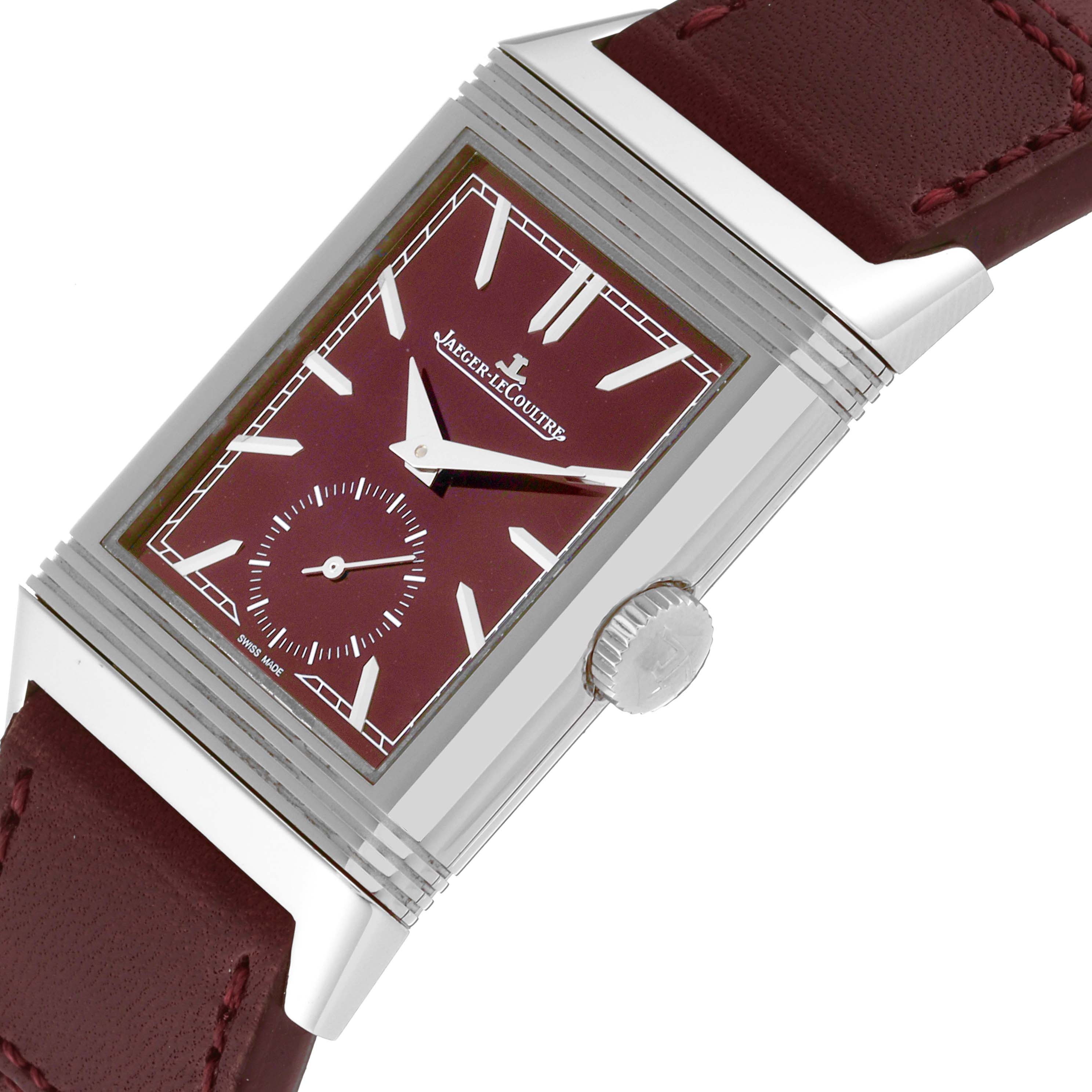 The Reverso model by Jaeger LeCoultre is shown at an angled side view, displaying the crown, watch face, and part of the strap.