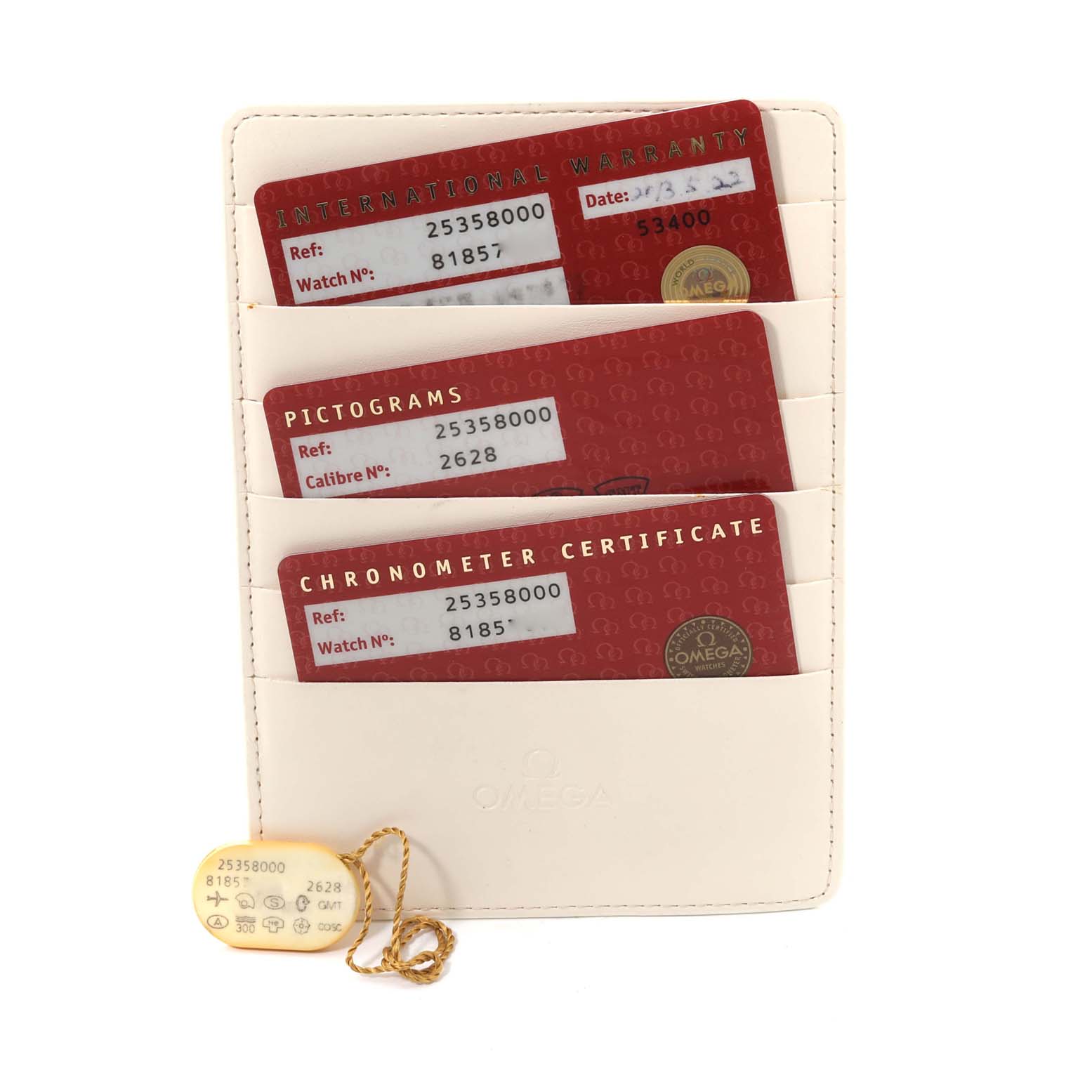 The image shows three red Omega cards and a hang tag for the Seamaster model, displayed in a white cardholder.