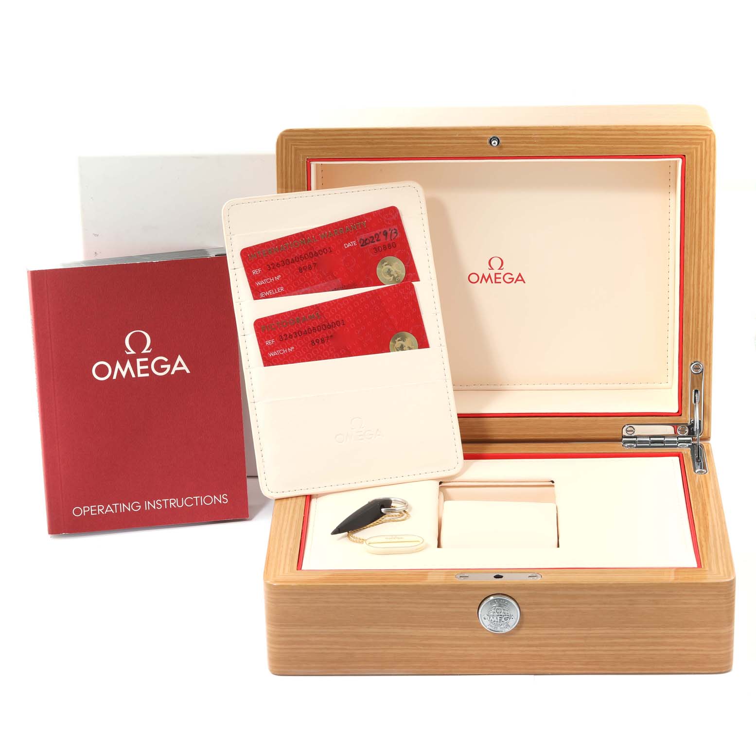 The image shows the packaging, cards, operating instructions, and accessories for the Omega Speedmaster 326.30.40.50.06.001 Men's Stainless Steel Grey Dial 326.30.40.50.06.001 Men's Stainless Steel Grey Dial watch.