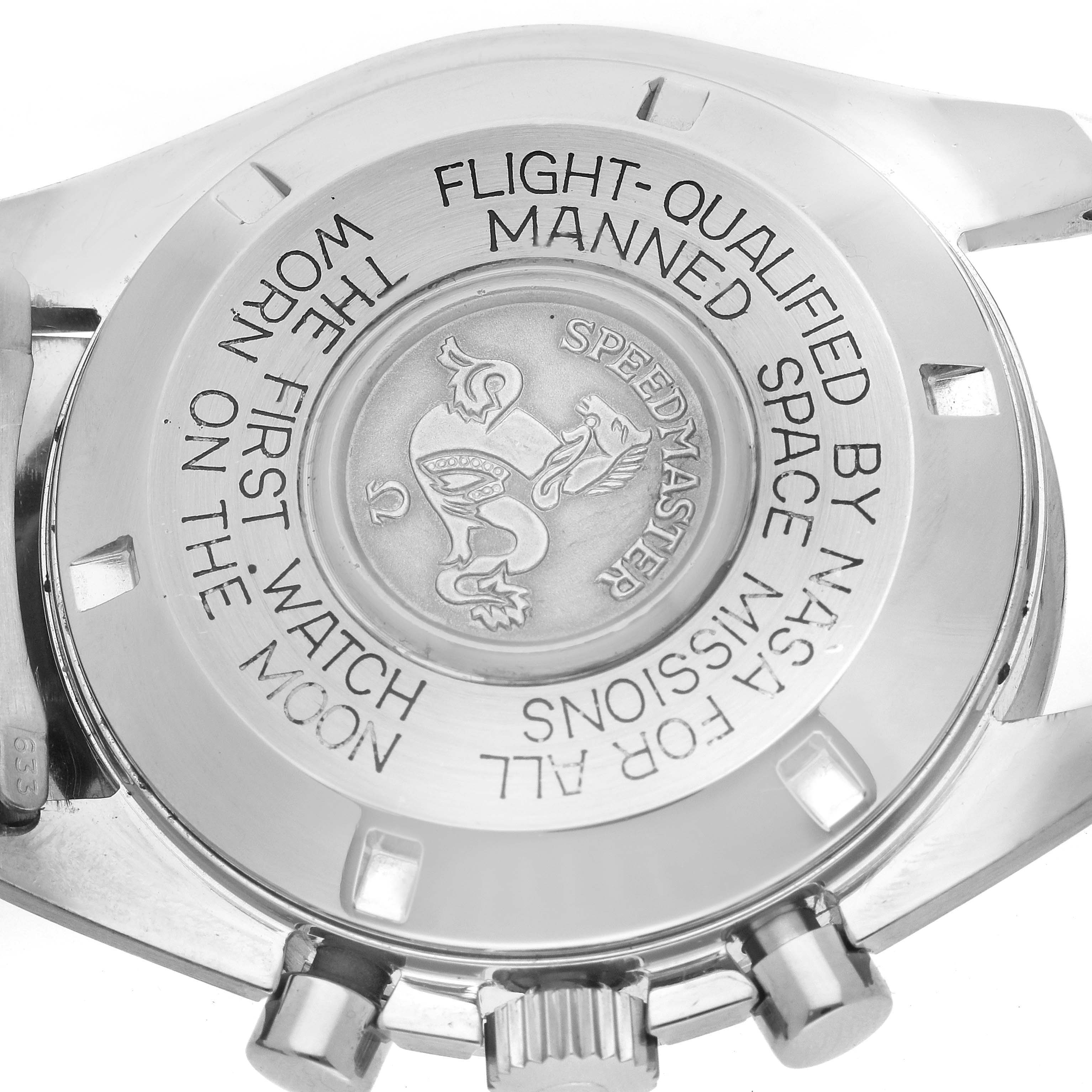 The image shows the back case of the Omega Speedmaster 145.022 Men
s Stainless Steel Black Dial 145.022 Men
s Stainless Steel Black Dial watch at a close-up angle, featuring inscriptions and the model
s emblem.