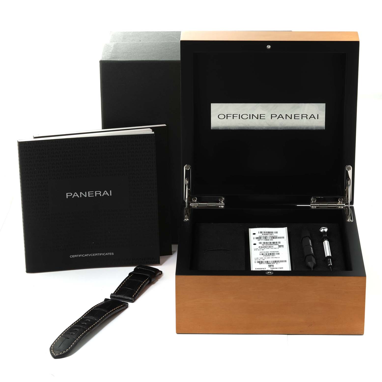 The image shows a Panerai Luminor PAM01321 Men
s Stainless Steel Black Dial PAM01321 Men
s Stainless Steel Black Dial watch box, spare strap, certificates, and tools from a front angle.