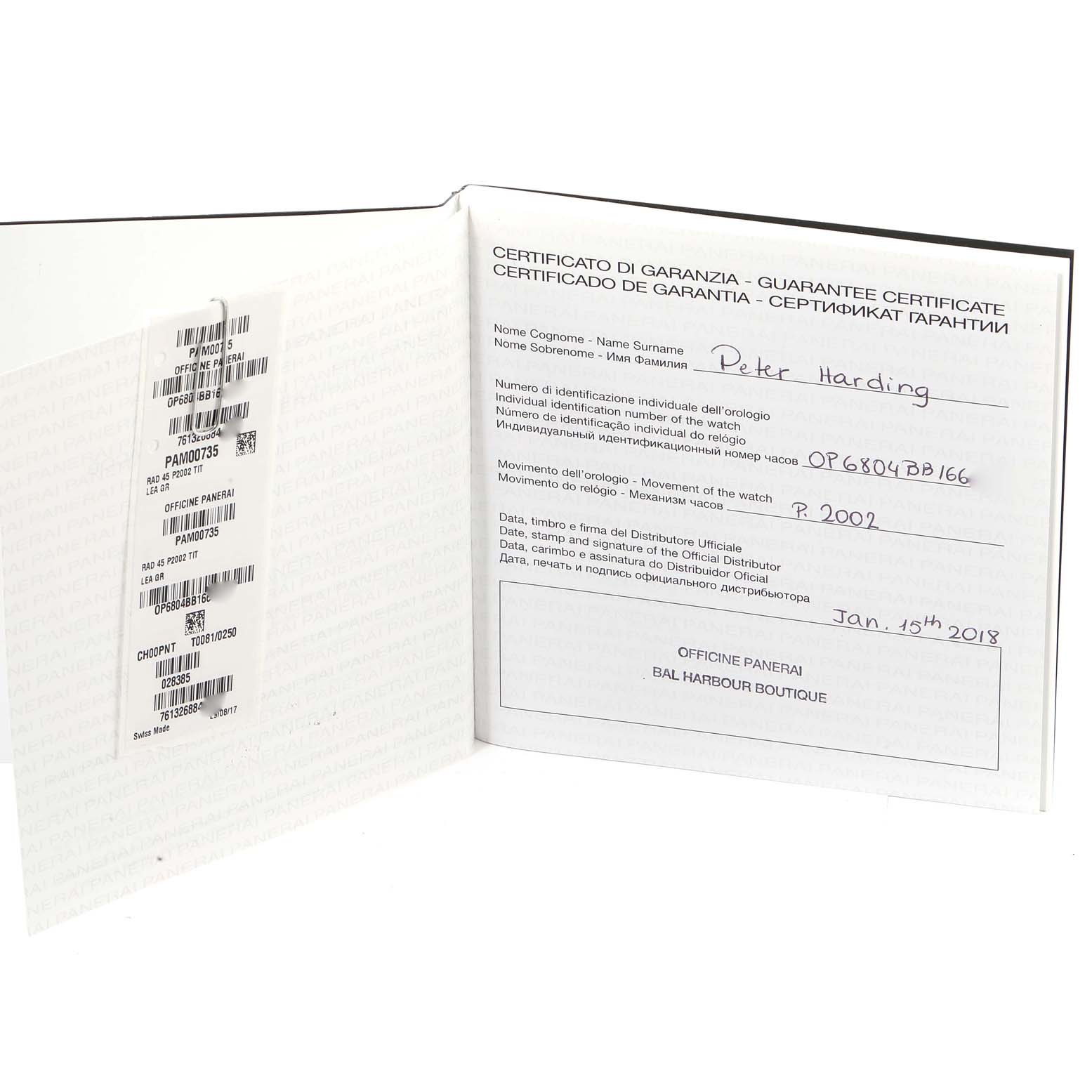 The image shows the guarantee certificate booklet for the Panerai Radiomir PAM00736 Men's Titanium Green Dial PAM00736 Men's Titanium Green Dial model, open and at an angle to reveal internal details.