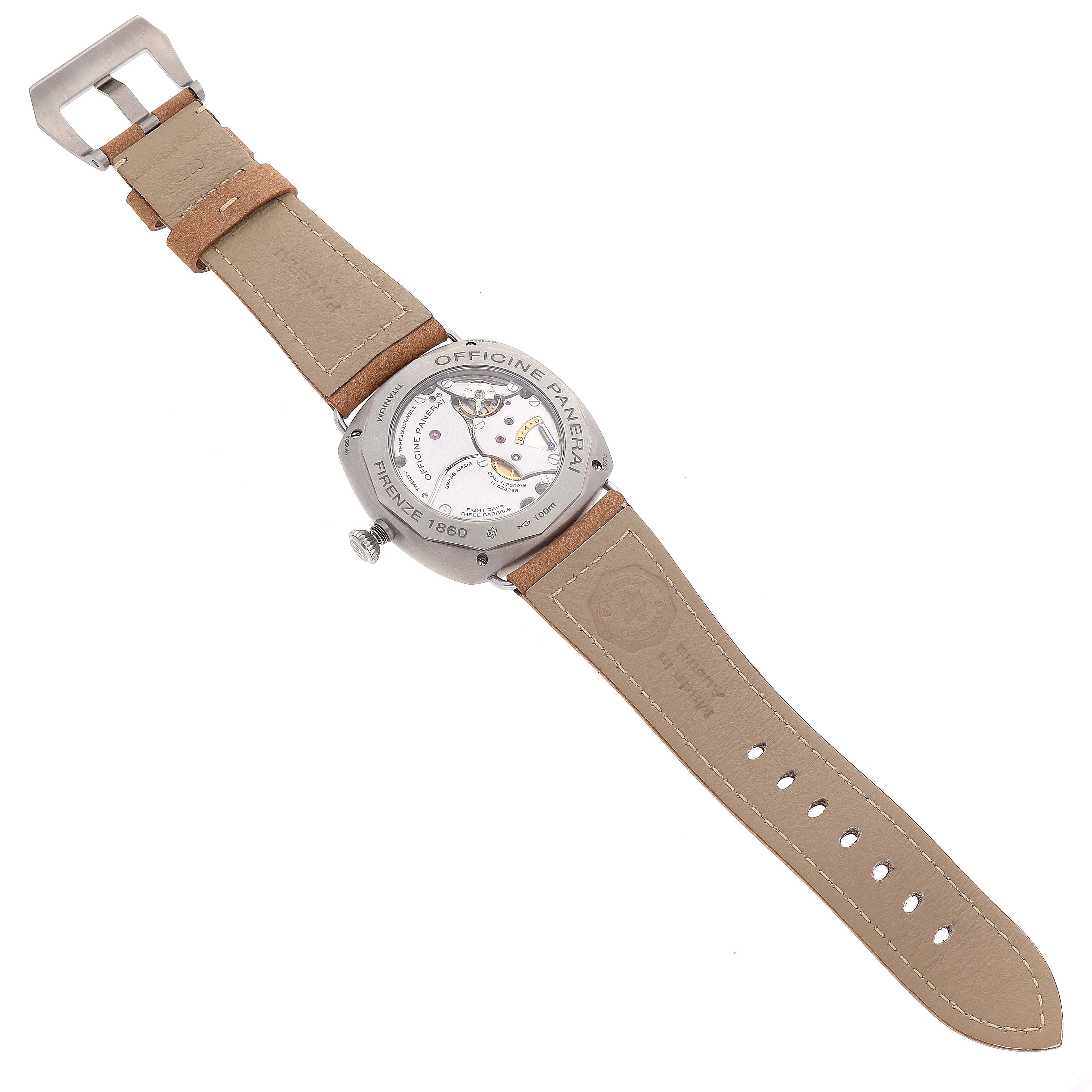 The image shows the back side of a Panerai Radiomir PAM00736 Men's Titanium Green Dial PAM00736 Men's Titanium Green Dial model watch, highlighting its movement and leather strap.