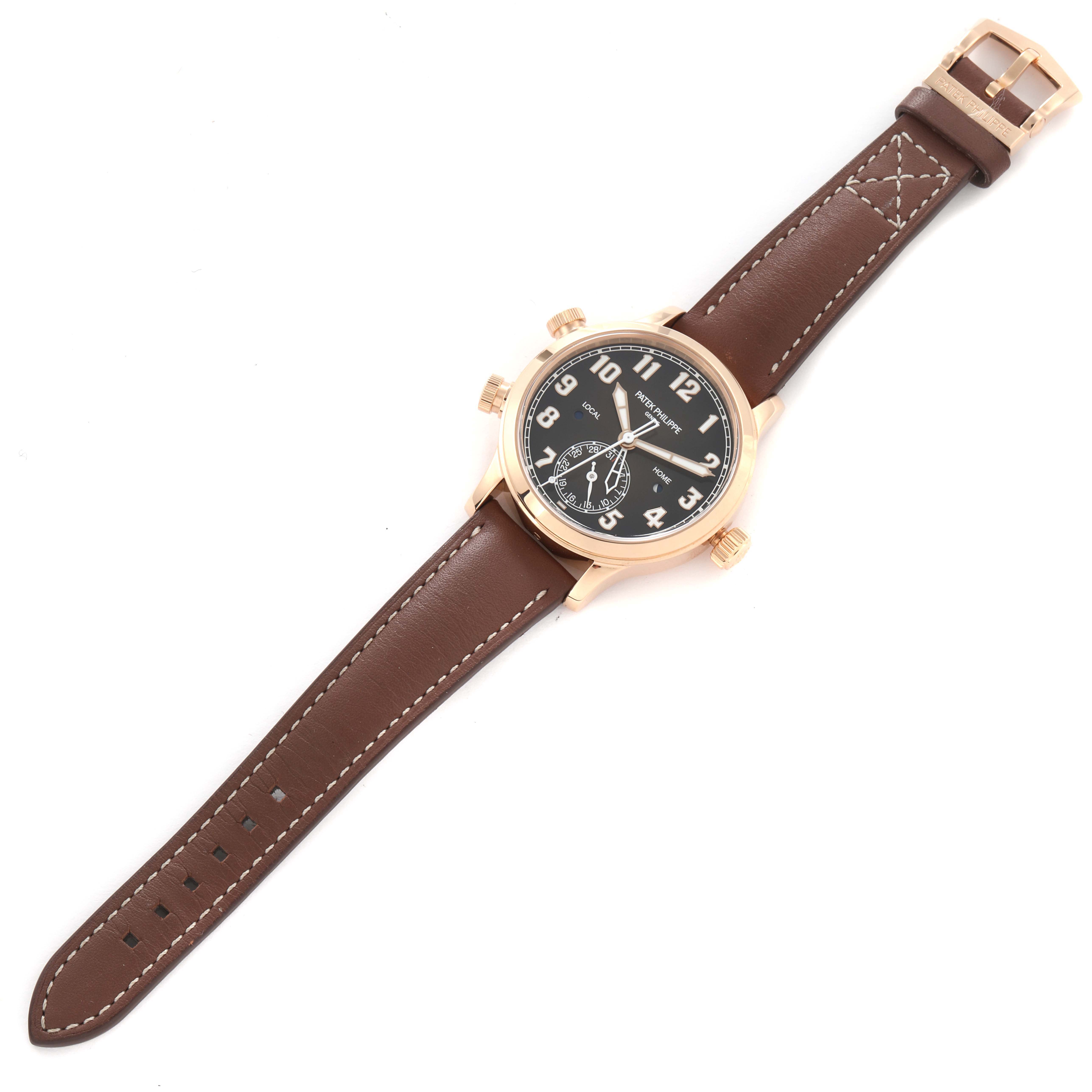 The Patek Philippe Calatrava 7234R-001 Women
s Rose Gold Brown Dial 7234R-001 Women
s Rose Gold Brown Dial watch is shown from a top-down angle, displaying the dial, case, crown, pushers, and brown leather strap.