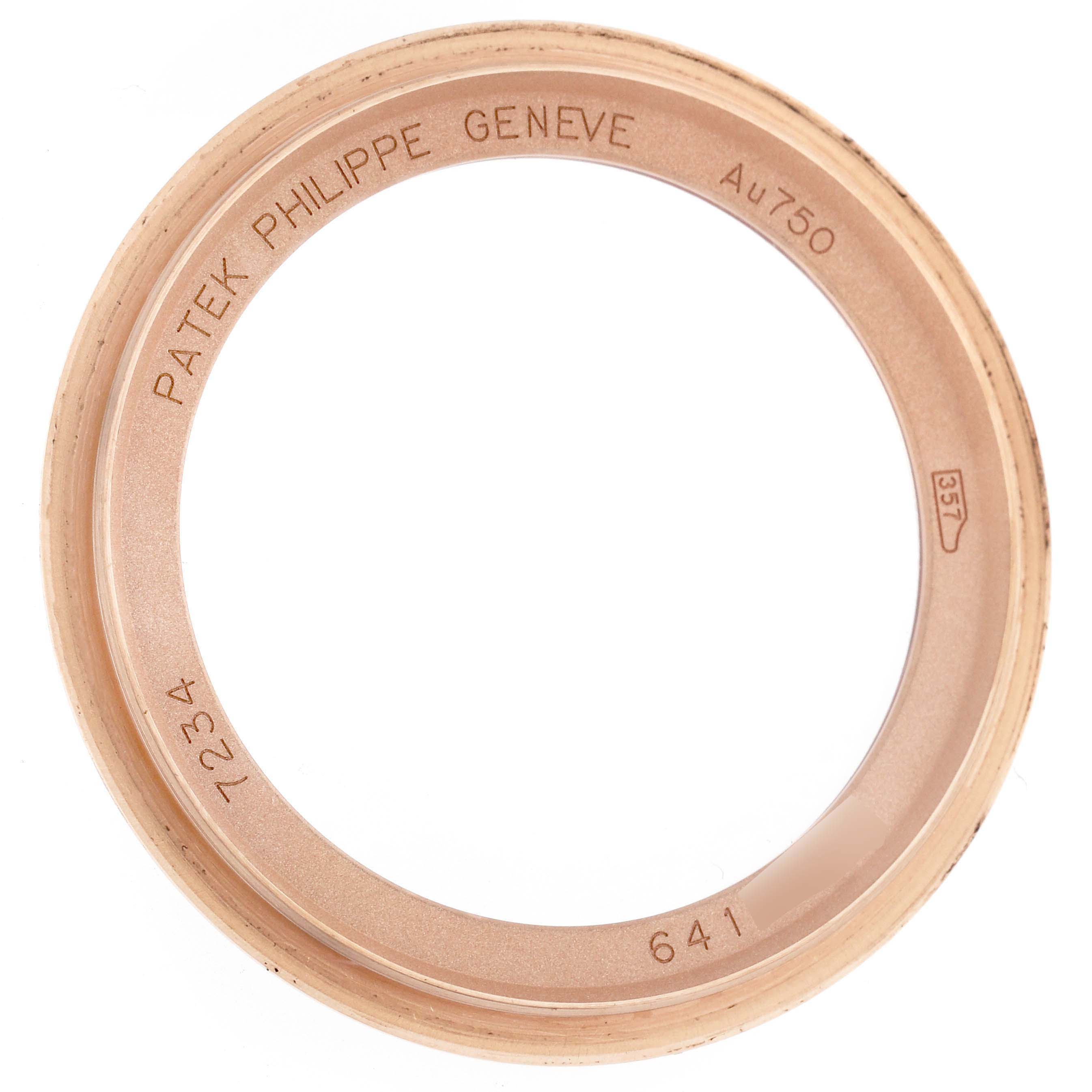 The image shows the bezel of a Patek Philippe Calatrava 7234R-001 Women
s Rose Gold Brown Dial 7234R-001 Women
s Rose Gold Brown Dial watch, viewed directly from above.