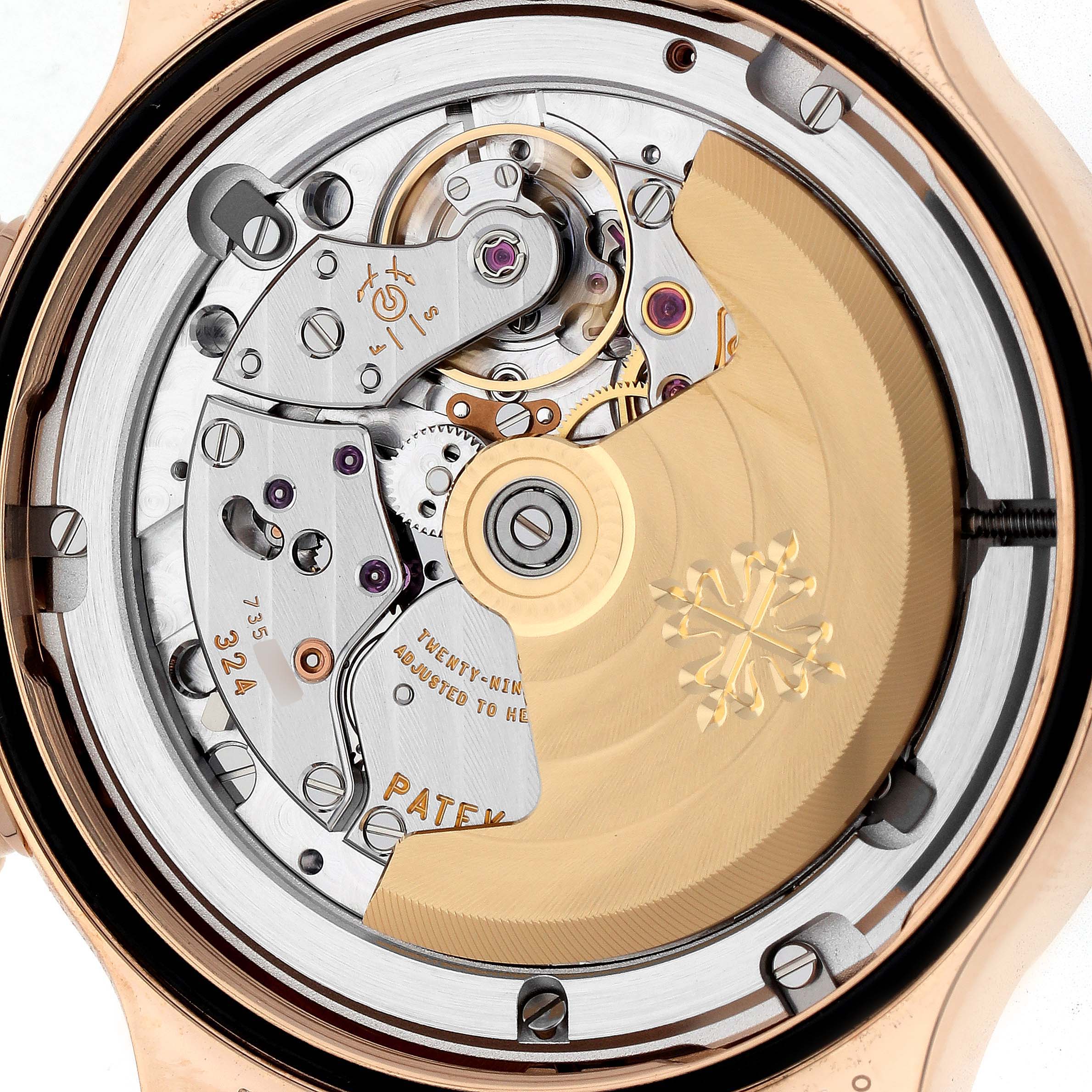 The image shows the back view of a Patek Philippe Calatrava 7234R-001 Women
s Rose Gold Brown Dial 7234R-001 Women
s Rose Gold Brown Dial watch, highlighting the intricate movement and rotor.
