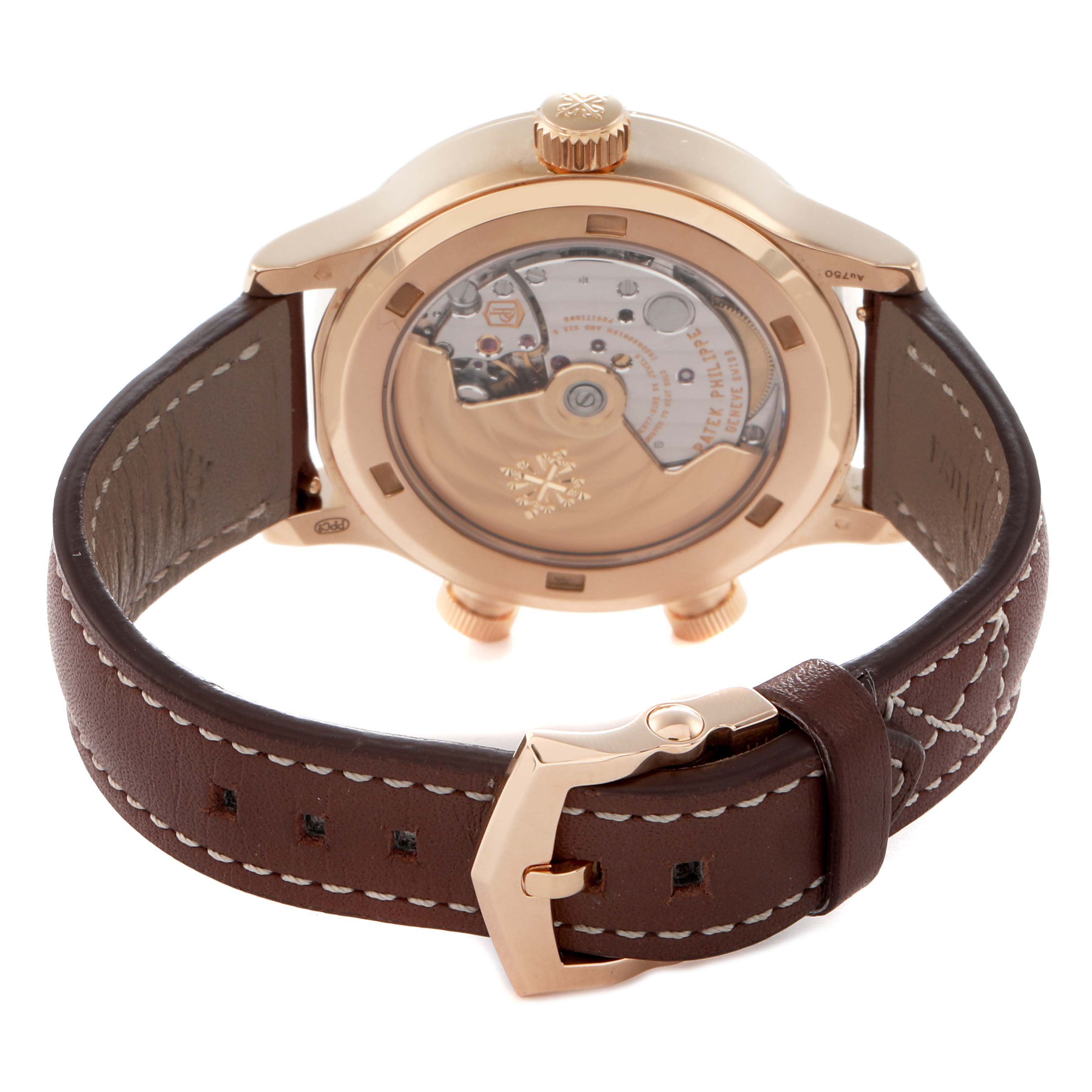 The image shows the back of a Patek Philippe Calatrava 7234R-001 Women
s Rose Gold Brown Dial 7234R-001 Women
s Rose Gold Brown Dial watch, highlighting its movement and brown leather strap with a gold buckle.