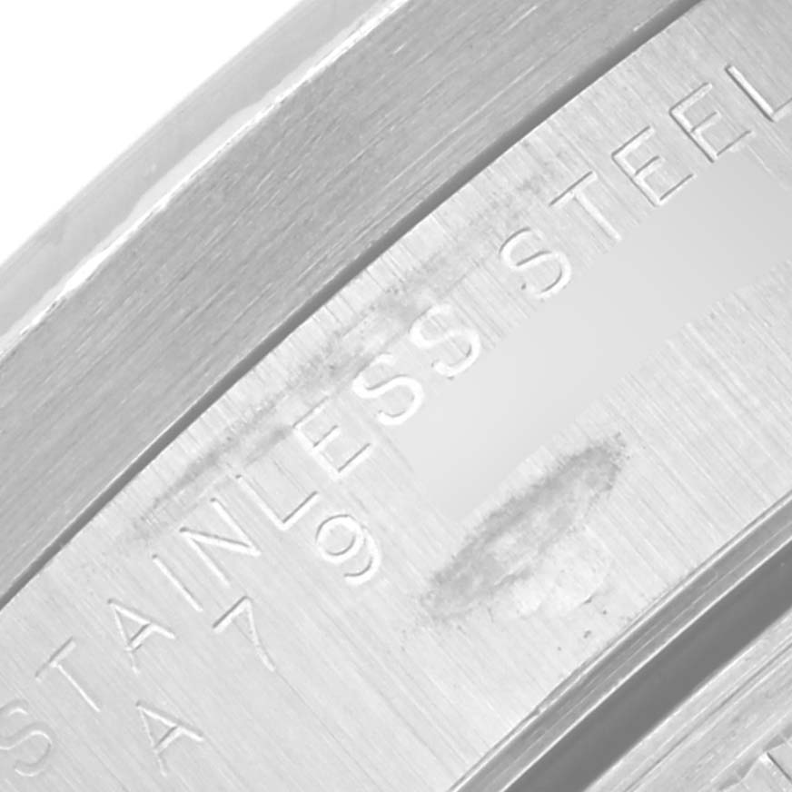 This close-up image shows the stainless steel casing with engravings of the Rolex Air-King 14010 Men's Stainless Steel Pink Dial 14010 Men's Stainless Steel Pink Dial watch.