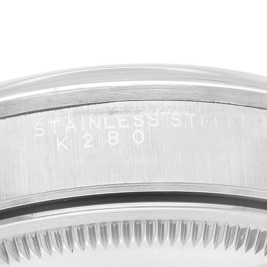 The image shows a close-up of the back casing of a Rolex Air-King 14000M Men's Stainless Steel Black Dial 14000M Men's Stainless Steel Black Dial watch, highlighting the model number and stainless steel text.