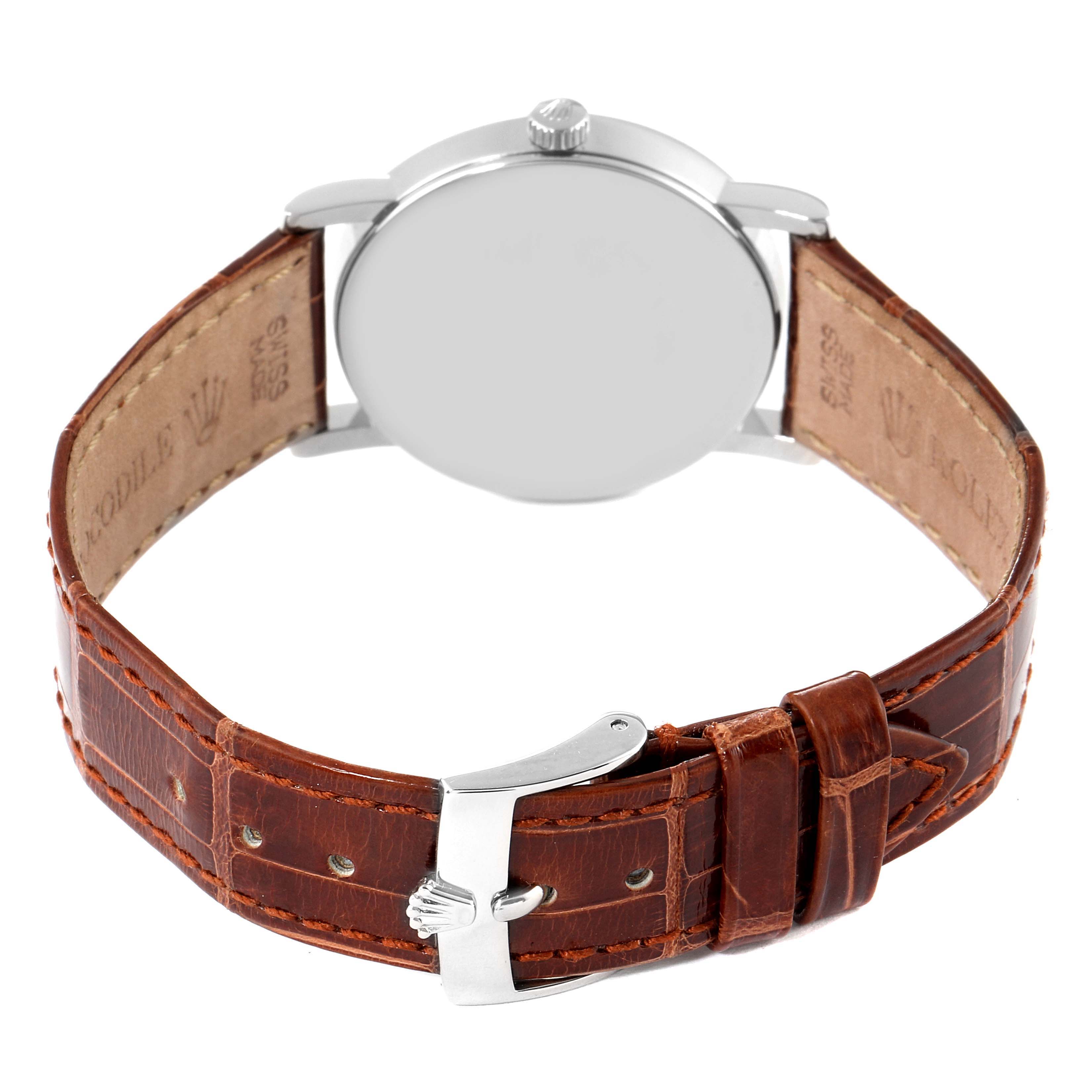 The image shows the back view of a Rolex Cellini 5115 Men's White Gold Brown Dial 5115 Men's White Gold Brown Dial watch, highlighting its buckle, leather strap, and case back.