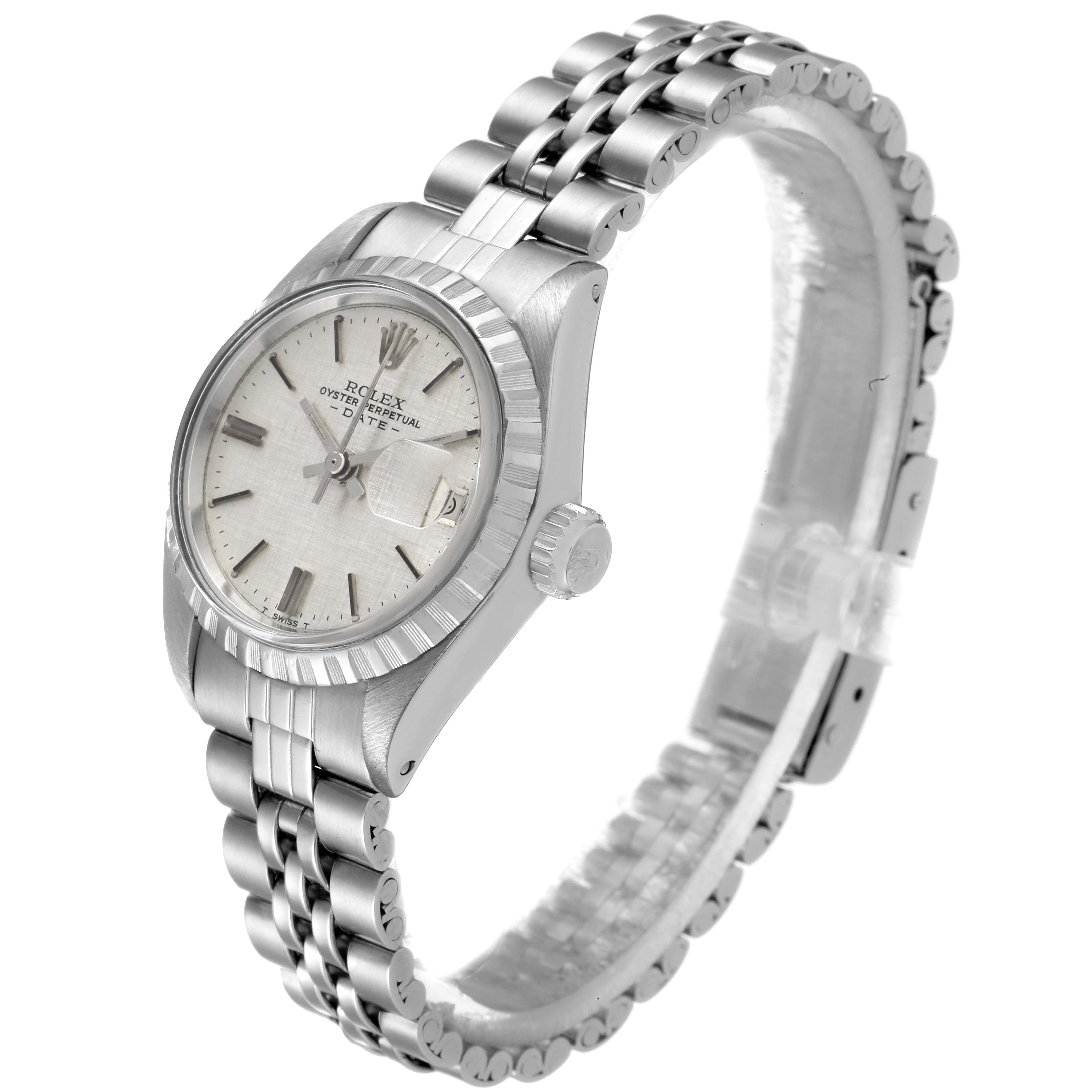 The image shows a side angle view of a Rolex Date 6924 Women's Stainless Steel Silver Dial 6924 Women's Stainless Steel Silver Dial model watch, highlighting its dial, bezel, and bracelet.
