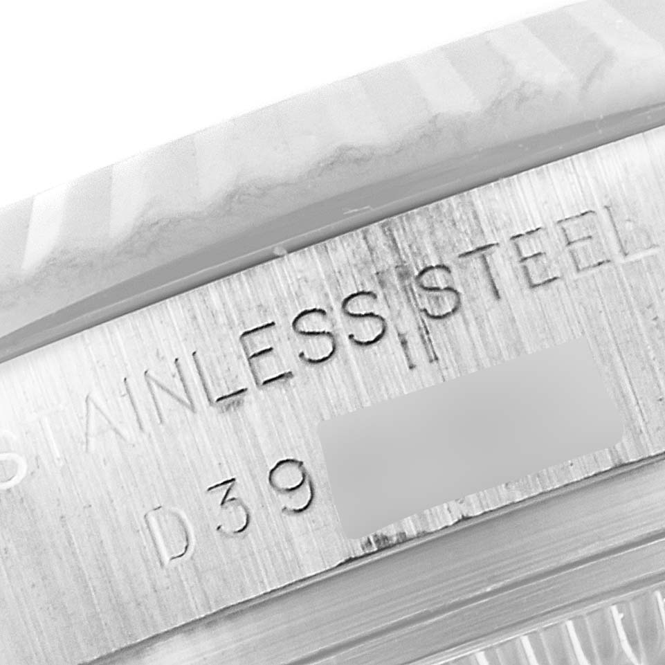 This close-up image of a Rolex Datejust 179174 Women
s Stainless Steel Mother of Pearl Dial 179174 Women
s Stainless Steel Mother of Pearl Dial watch shows the engraved details of the stainless steel case.