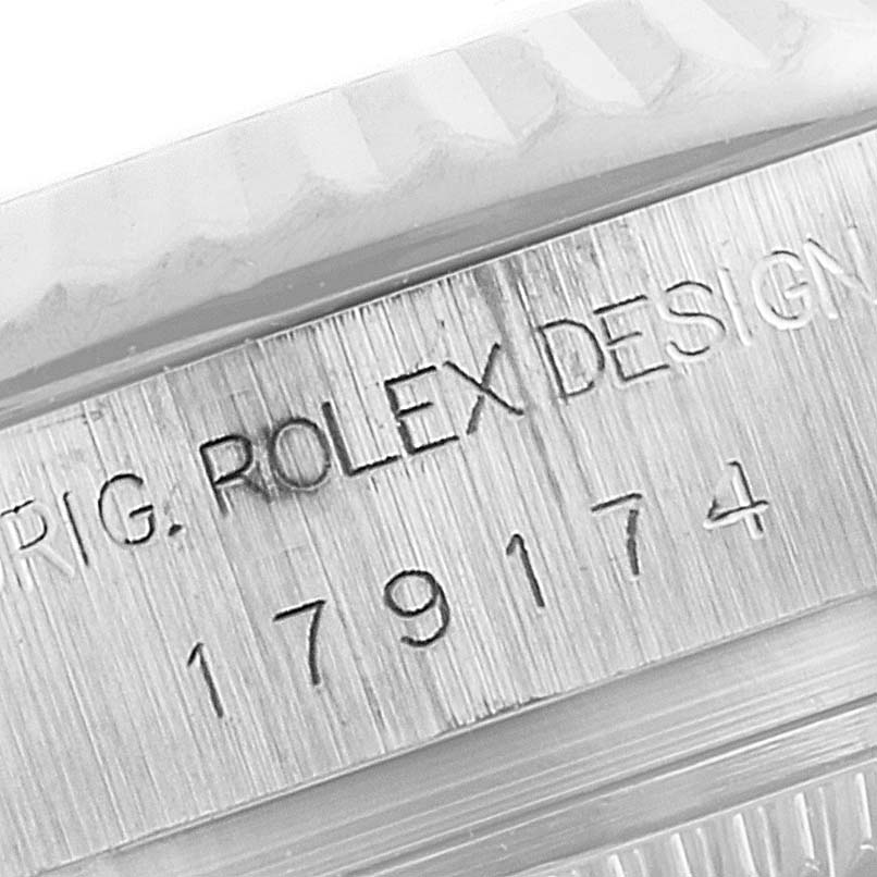 This close-up image shows the engraved model number and design inscription on the case of a Rolex Datejust 179174 Women
s Stainless Steel Mother of Pearl Dial 179174 Women
s Stainless Steel Mother of Pearl Dial watch.