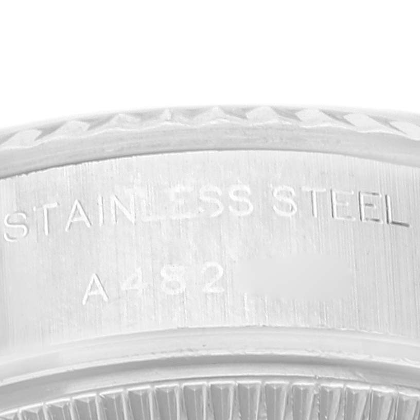 This image shows a close-up view of the stainless steel engraving on the bezel of a Rolex Datejust 79174 Women's Stainless Steel Silver Dial 79174 Women's Stainless Steel Silver Dial watch.
