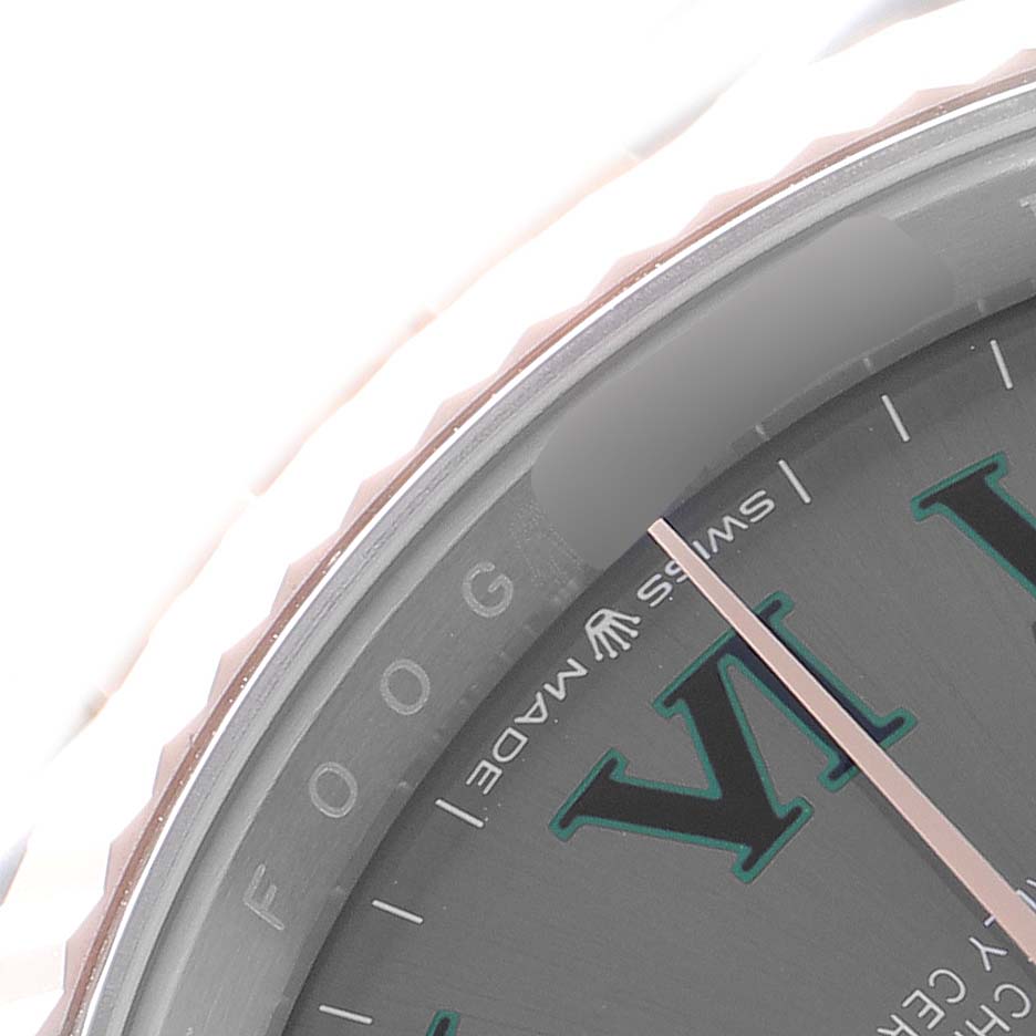 The image shows a close-up of the dial and bezel of a Rolex Datejust 126231 Men
s Steel and Gold (two tone) Grey Dial 126231 Men
s Steel and Gold (two tone) Grey Dial, highlighting the edge of the watch face and "Swiss Made" text.