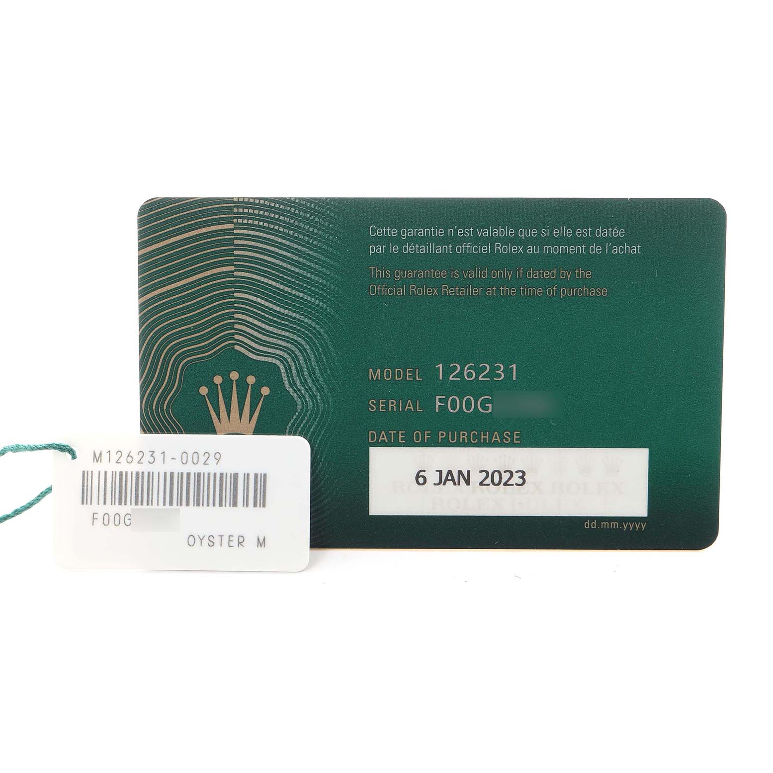 The image shows a Rolex Datejust 126231 Men
s Steel and Gold (two tone) Grey Dial 126231 Men
s Steel and Gold (two tone) Grey Dial guarantee card and tag displaying the model number 126231 and purchase date.