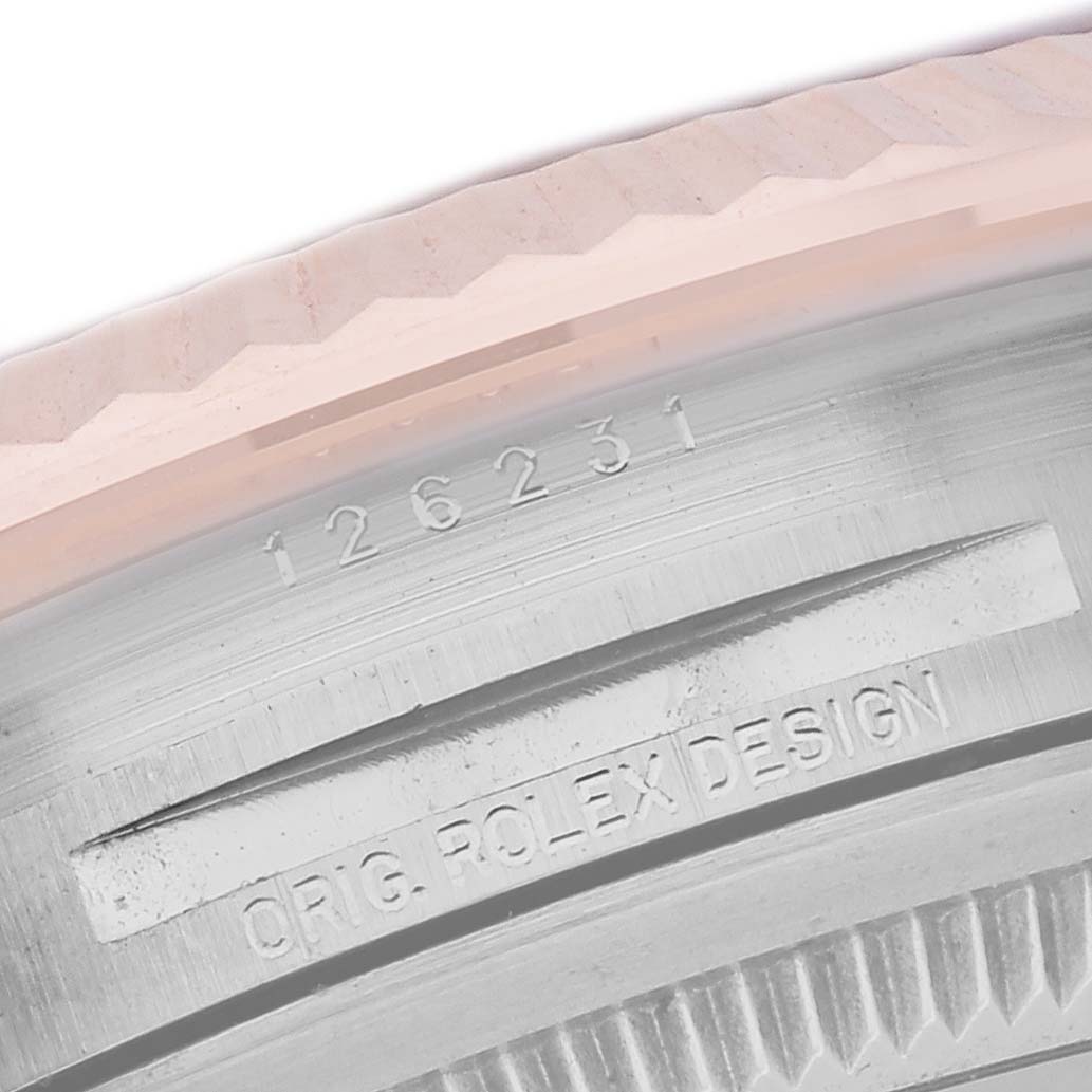 The image shows a close-up of the inner bezel and serial number of a Rolex Datejust 126231 Men
s Steel and Gold (two tone) Grey Dial 126231 Men
s Steel and Gold (two tone) Grey Dial.