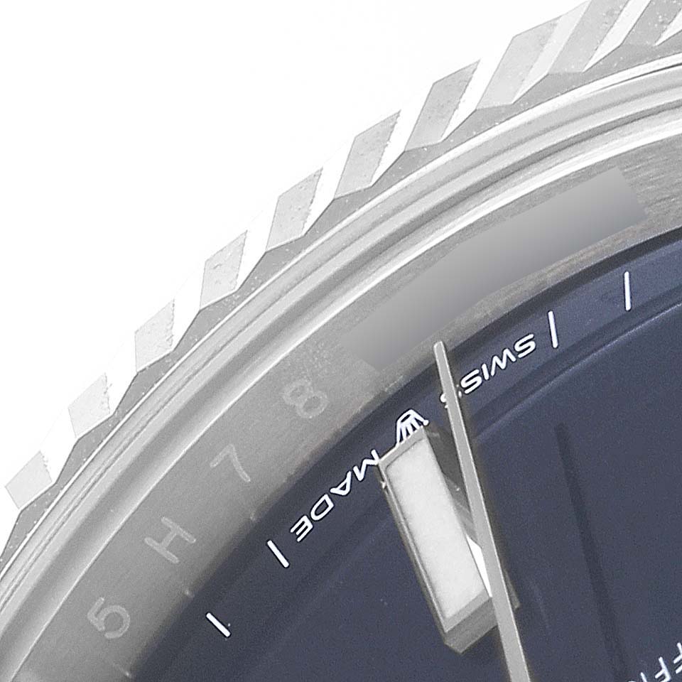 The image shows a close-up of the bezel, part of the dial, and hands of a Rolex Datejust 41 126334 Men
s Stainless Steel Blue Dial 126334 Men
s Stainless Steel Blue Dial watch.